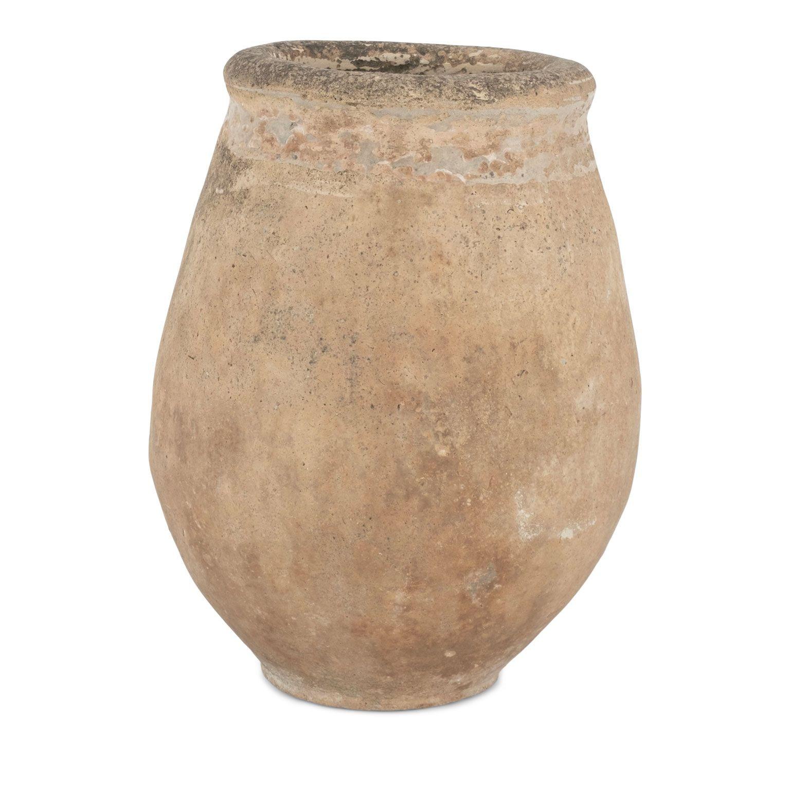 Early French Biot jar with remnants of yellow glaze along its rim. Dates to the late 18th or early 19th century. Nice patina and pitted surface from centuries of natural wear and use.
