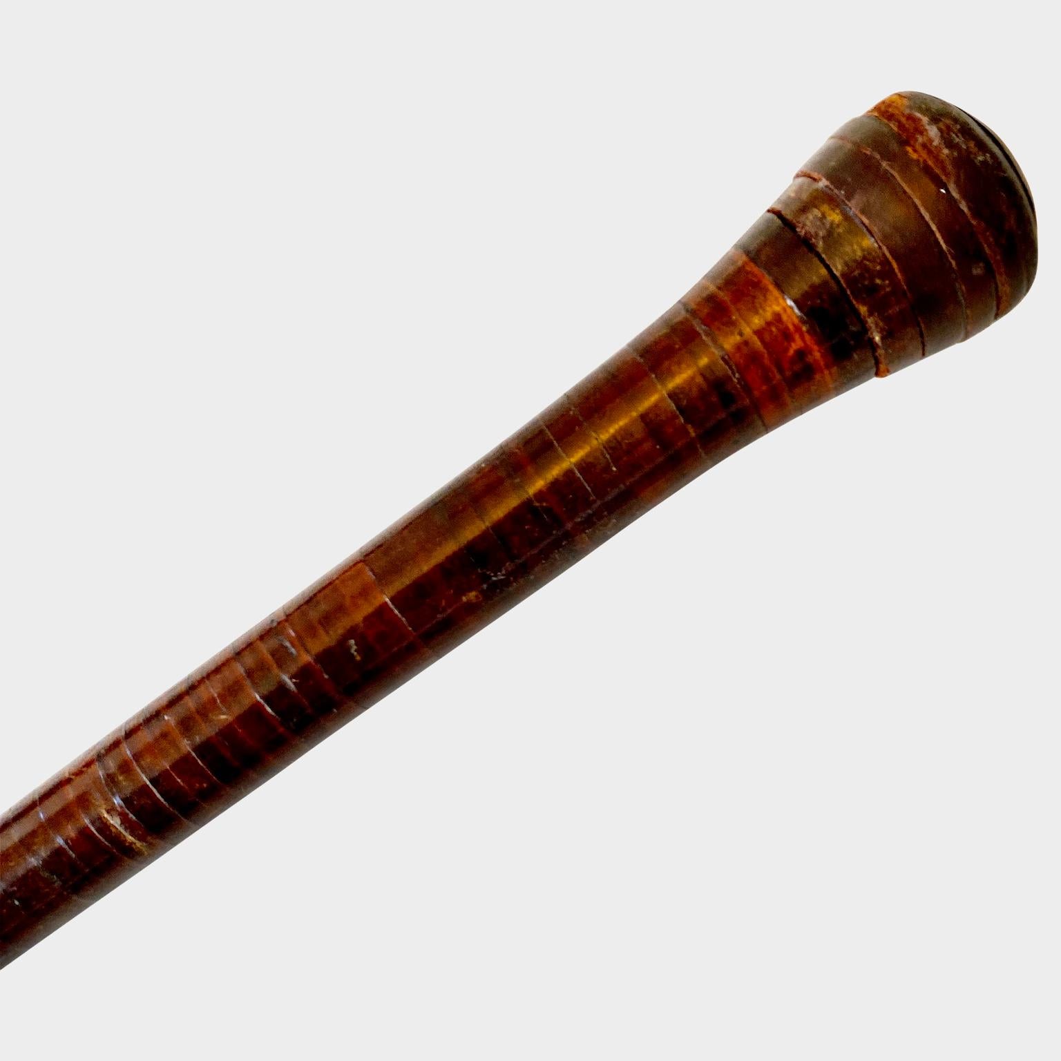 Early French leather string coated brass top cane.