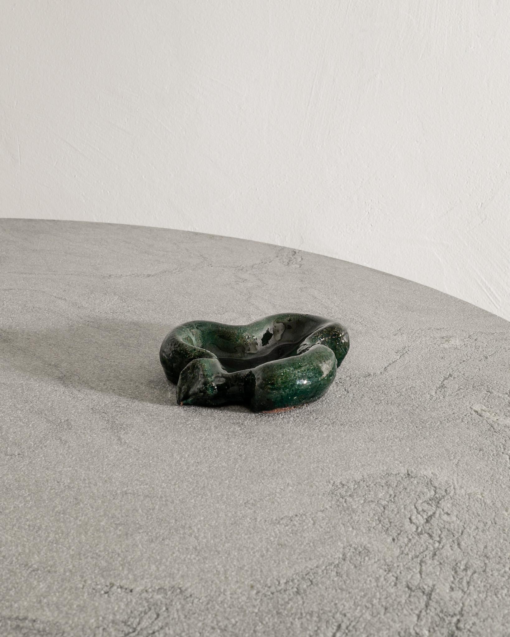 Rare and early French mid century sculptural stoneware ashtray / bowl with dark green glaze by Georges Jouve produced in 1940s. In good original condition and signed with the iconic 