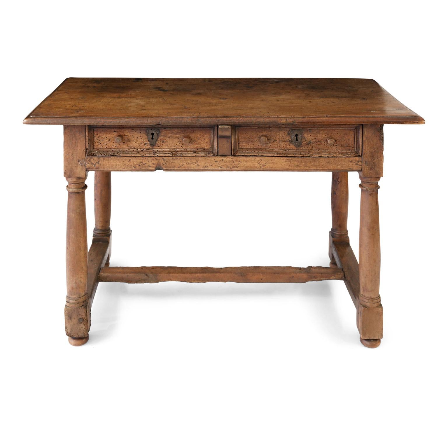 Early French walnut table with mortise and tenon construction. Past restorations, expected evidence of worm damage (newly fumigated) and recent tightening of joints. Very stable, sturdy. Beautiful patina. Hand-chiseled sunken relief decoration