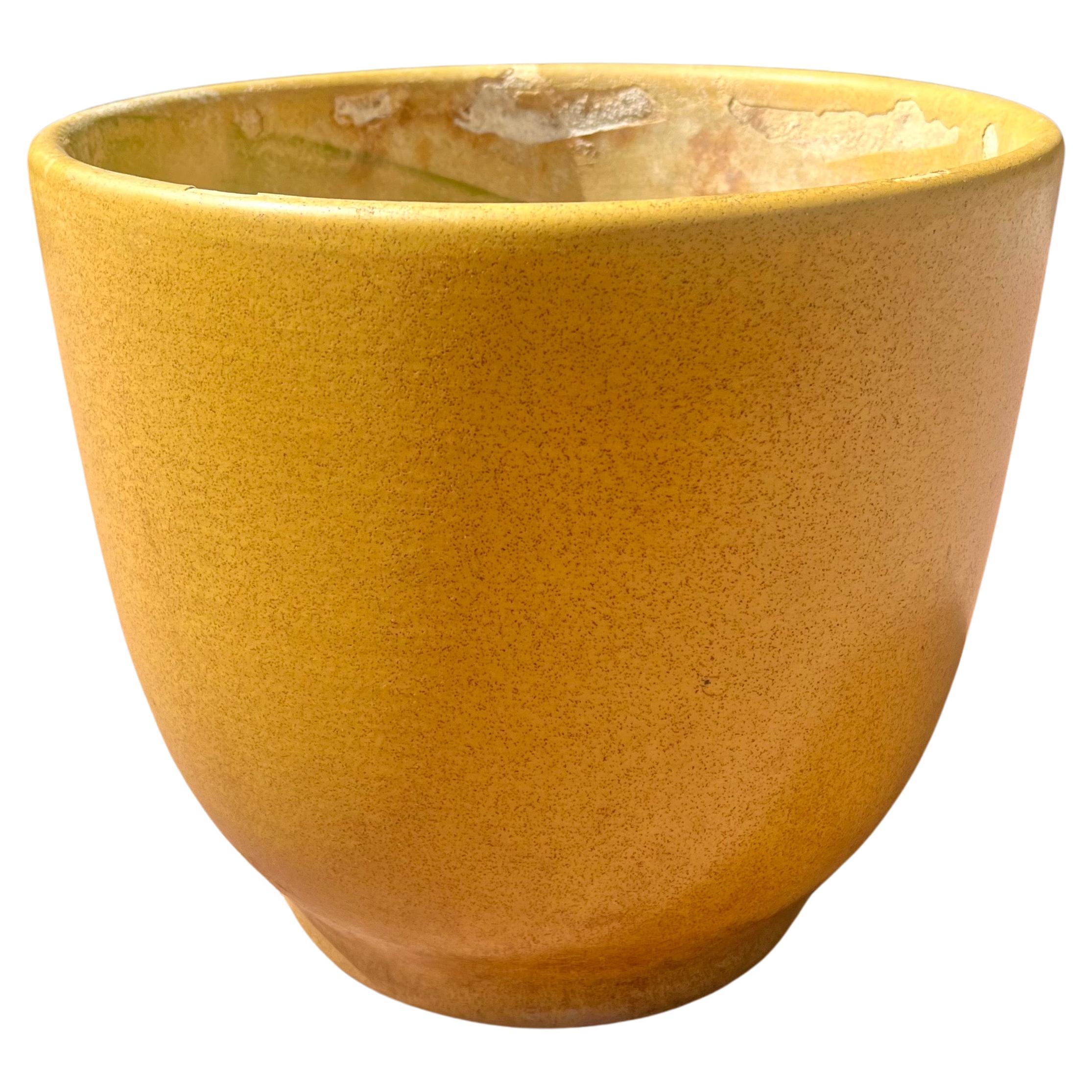 Large rounded planter pot. Earlier production by Gainey of LaVerne Ca. beautiful mustard with spreckles glaze satin finish, Beautiful shape and color sold AS/IS condition all chips on the inside as shown outside its clean very cool bell inverted
