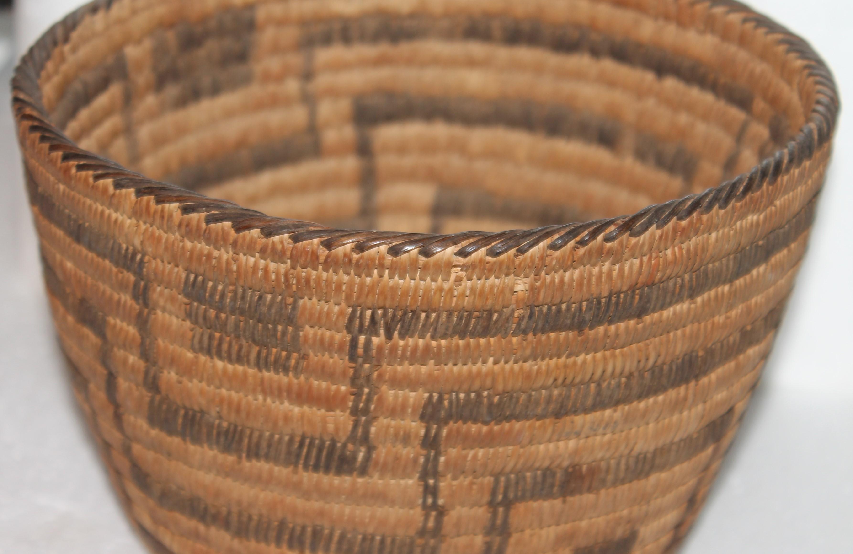 This fine and very early Pima American Indian hand woven basket is in fine as found condition. This wonderful basket has a nice aged patina and has come from a private American Indian collection.