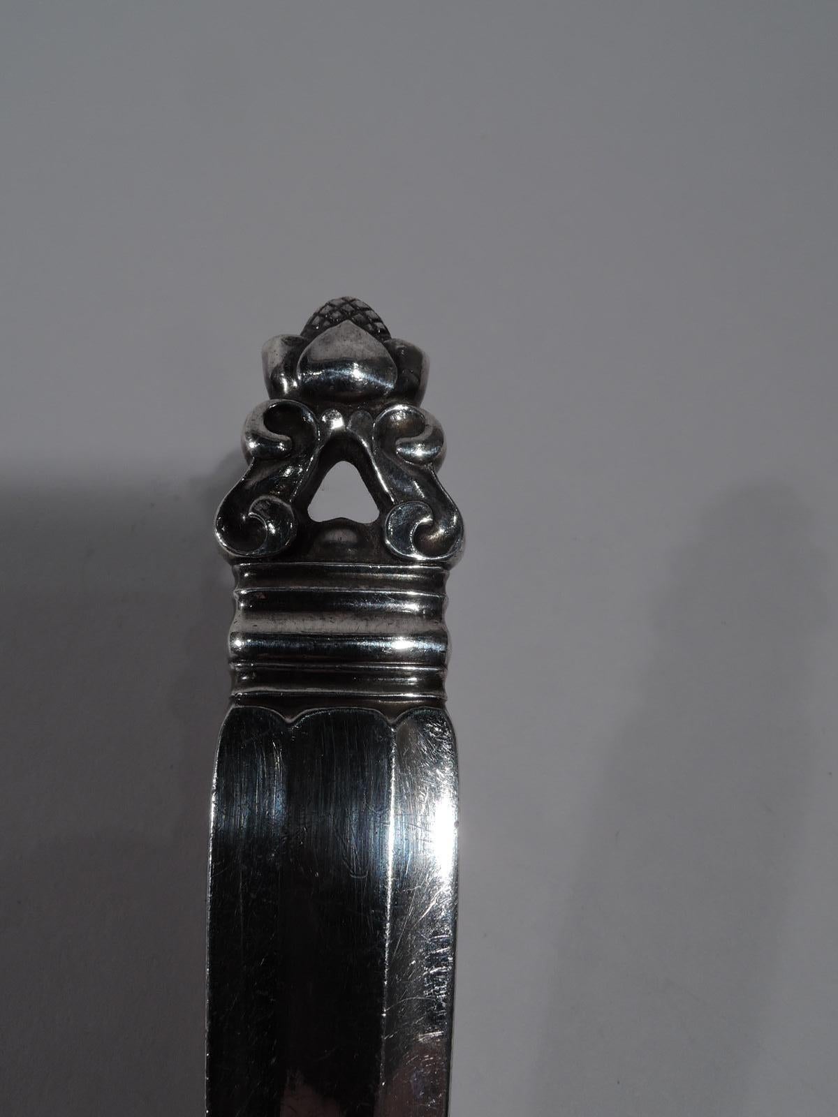 Acorn sterling silver pie server. Made by Georg Jensen in Copenhagen. Classical fluted handle and stylized nut terminal. Blade flat and triangular. A beautiful piece in the historic pattern that was designed by Johan Rohde and first produced in