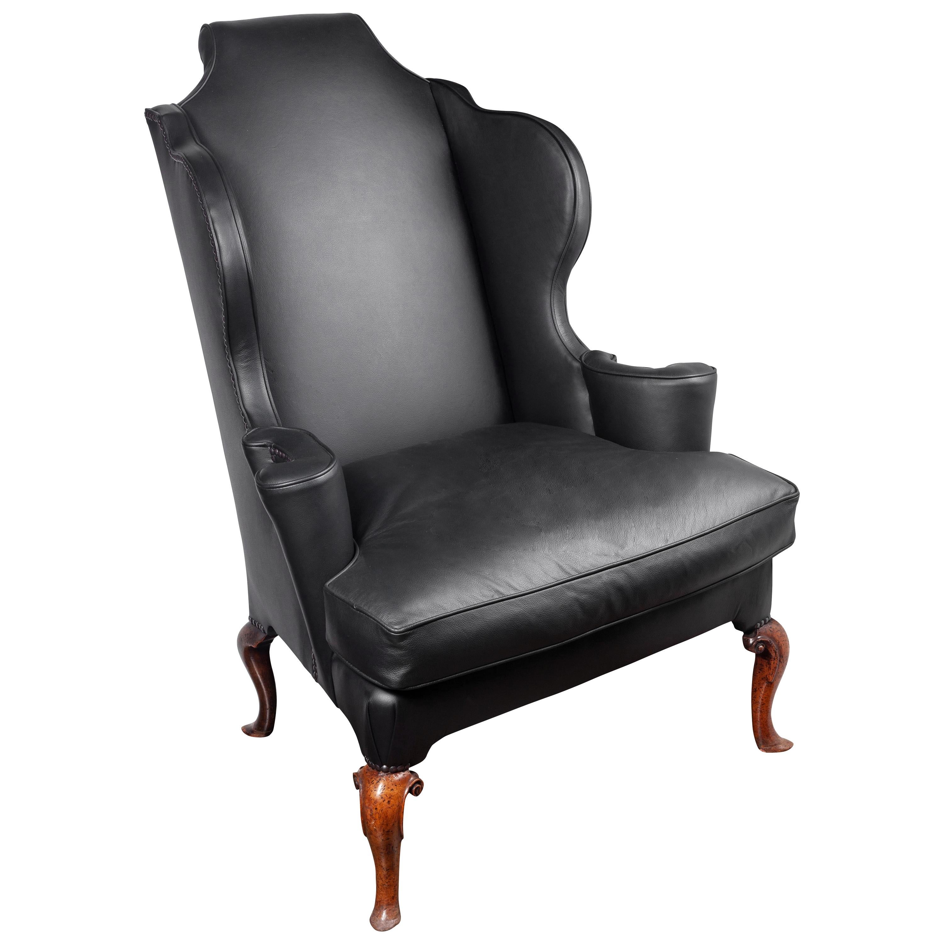 An Early George I Walnut and Black Leather Upholstered Wingback Armchair For Sale