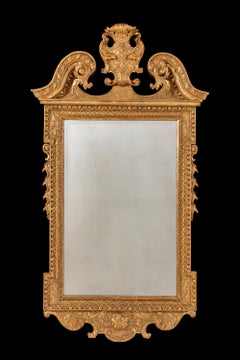 Early George II Carved Giltwood and Gesso Mirror in the Manner of William Kent