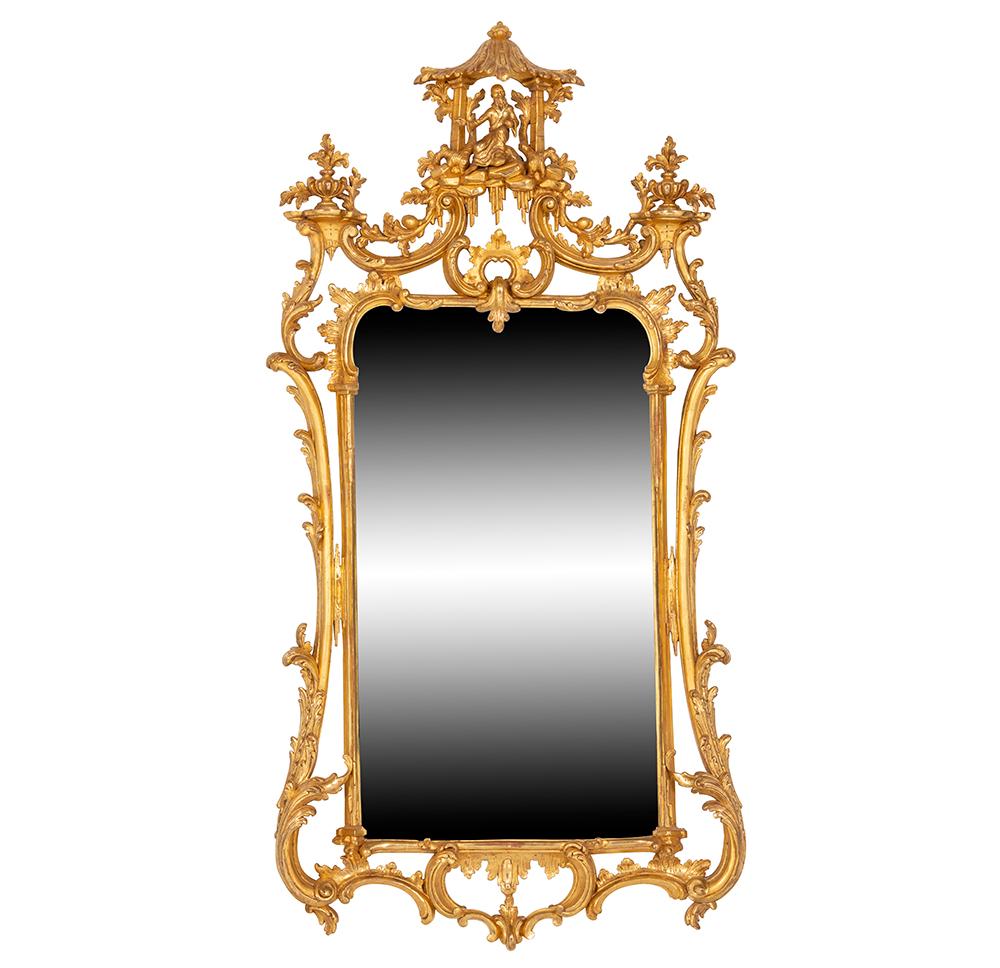 
Introducing an Early George III Giltwood Mirror in the Chinese Chippendale design, a magnificent antique dating back to the early days of the George III era. This stunning mirror exudes timeless elegance and historical charm, making it a true