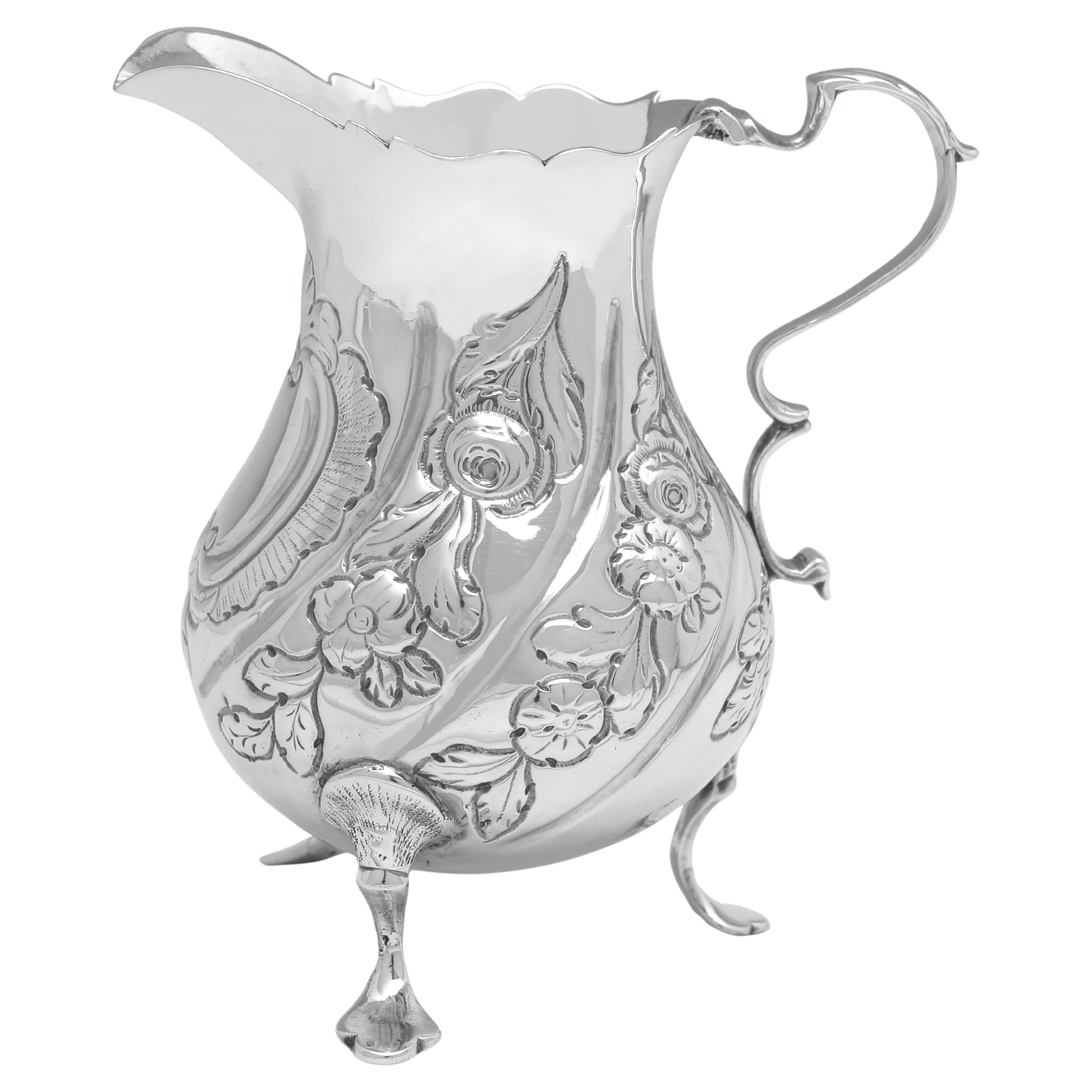 Early George III period antique sterling silver cream jug made in London in 1763