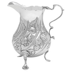 Early George III period antique sterling silver cream jug made in London in 1763