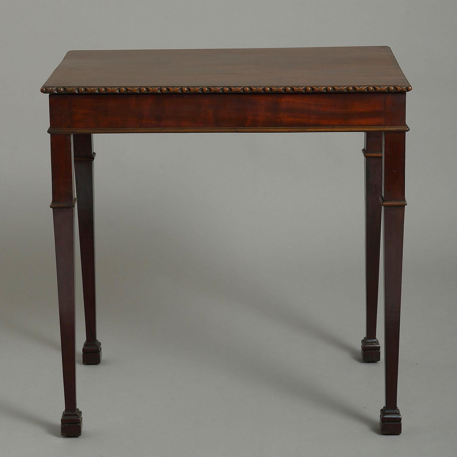 Early 20th century George III style mahogany table. A rectangular top with egg-and-dart border and with collared mouldings on the square tapering legs terminating in moulded block feet.