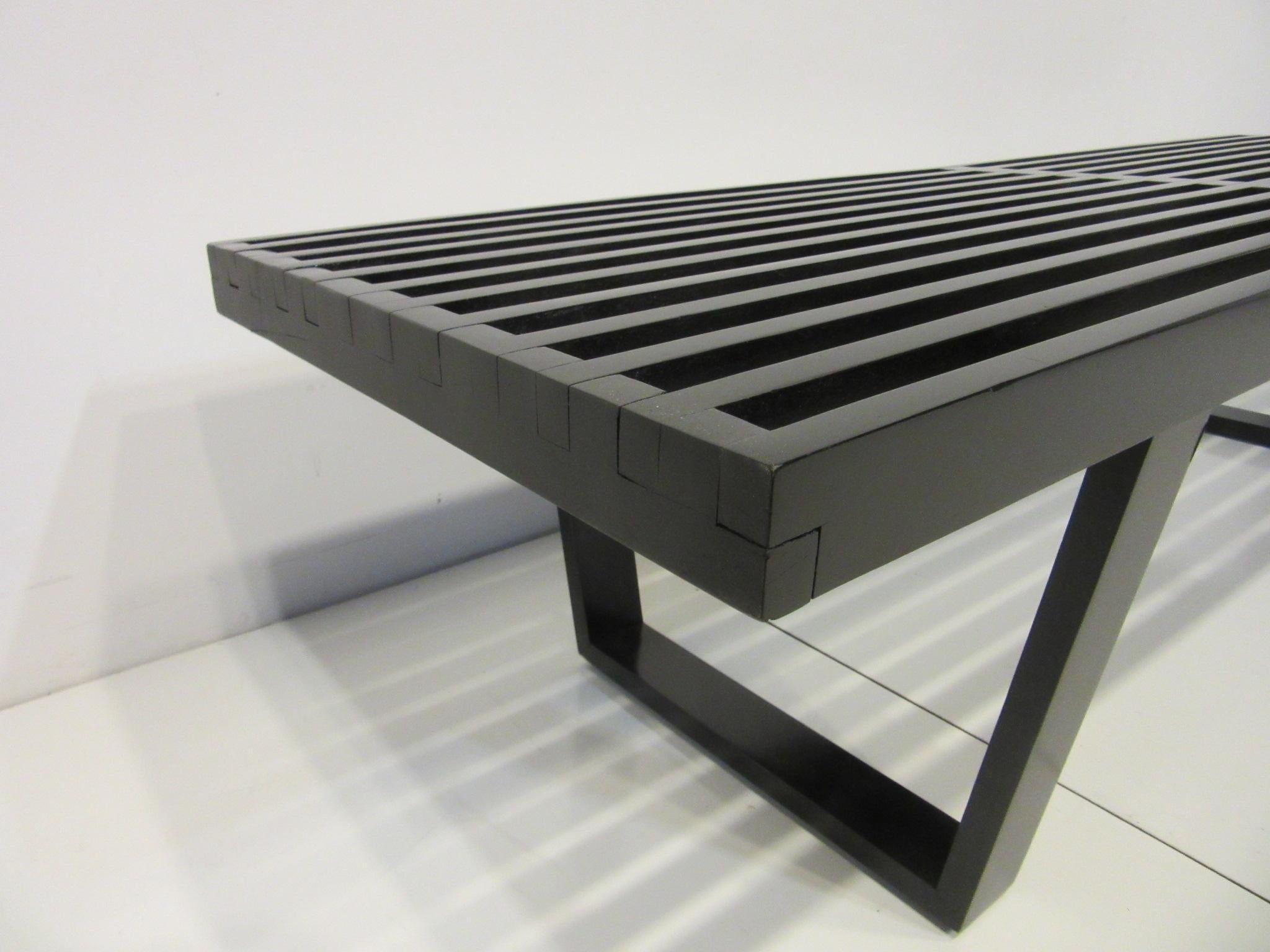 A satin black longer slat bench / coffee table retaining the early designers foil tag to the underside. Manufactured by the Herman Miller Furniture company an iconic piece that is well constructed and can be used as a bench, coffee table, end of the