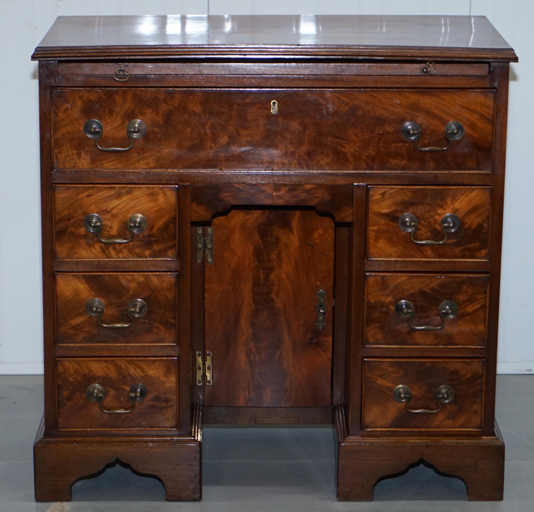 We are delighted to offer for sale this lovely early Georgian flamed Mahogany kneehole desk with sliding writing section 

A well made and decorative piece, the flamed mahogany is stunning to look at from every angle. Naturally, the knee hole is