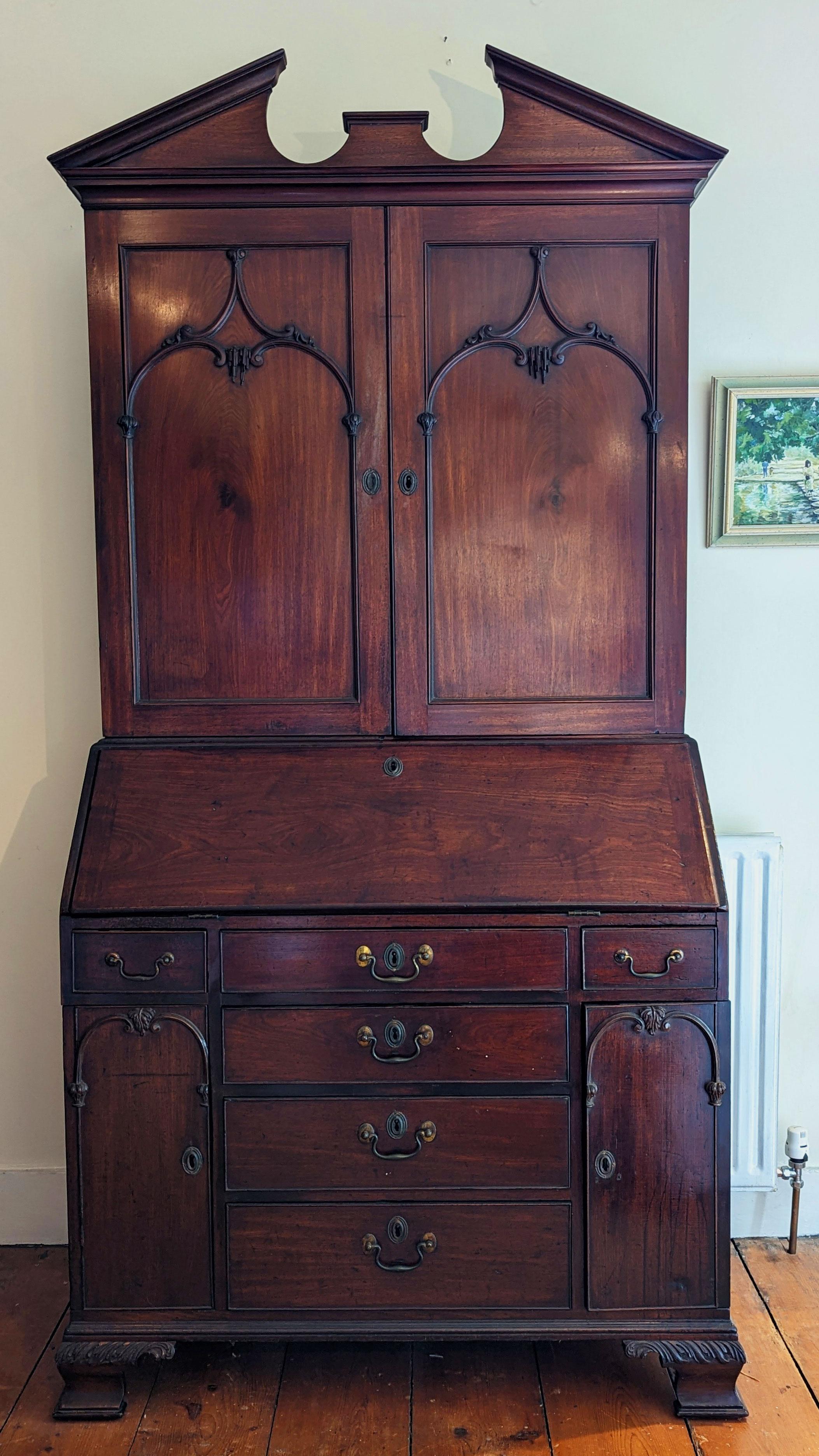 An unusual and possibly unique example of a Chippendale design for a carved mahogany bureau bookcase. 

See included photos of scans of the designs from Chippendale’s - The Gentleman and Cabinet-Makers Director. Ref CV111 Desk and Bookcase.

This