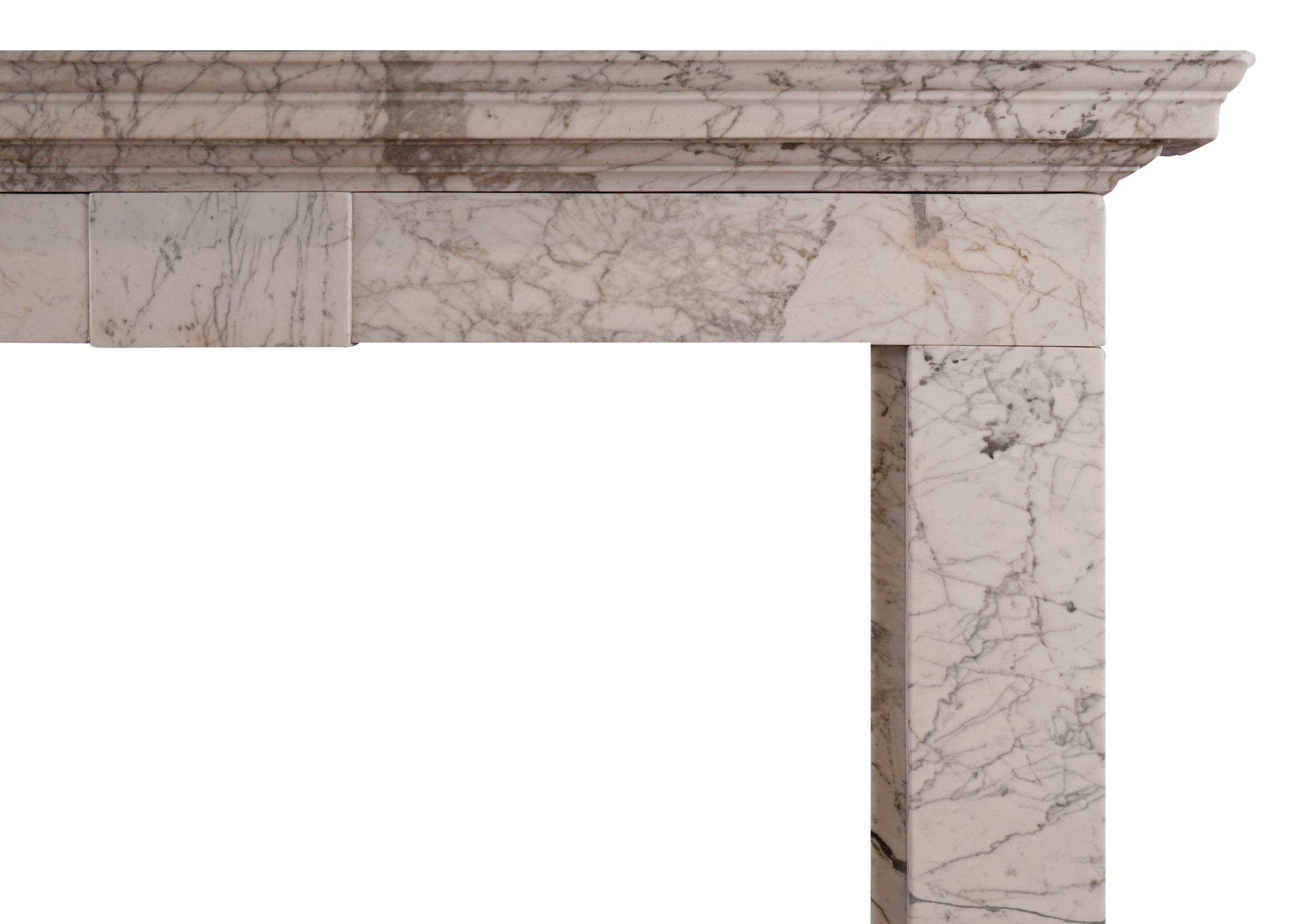 An early Georgian fireplace in heavily pencil-veined statuary marble. The jambs surmounted by plain frieze with centre block. Moulded shelf above. English, elegant and simple design.


Measures: 
Shelf width 1675 mm / 66 in
Overall height: 1260 mm /