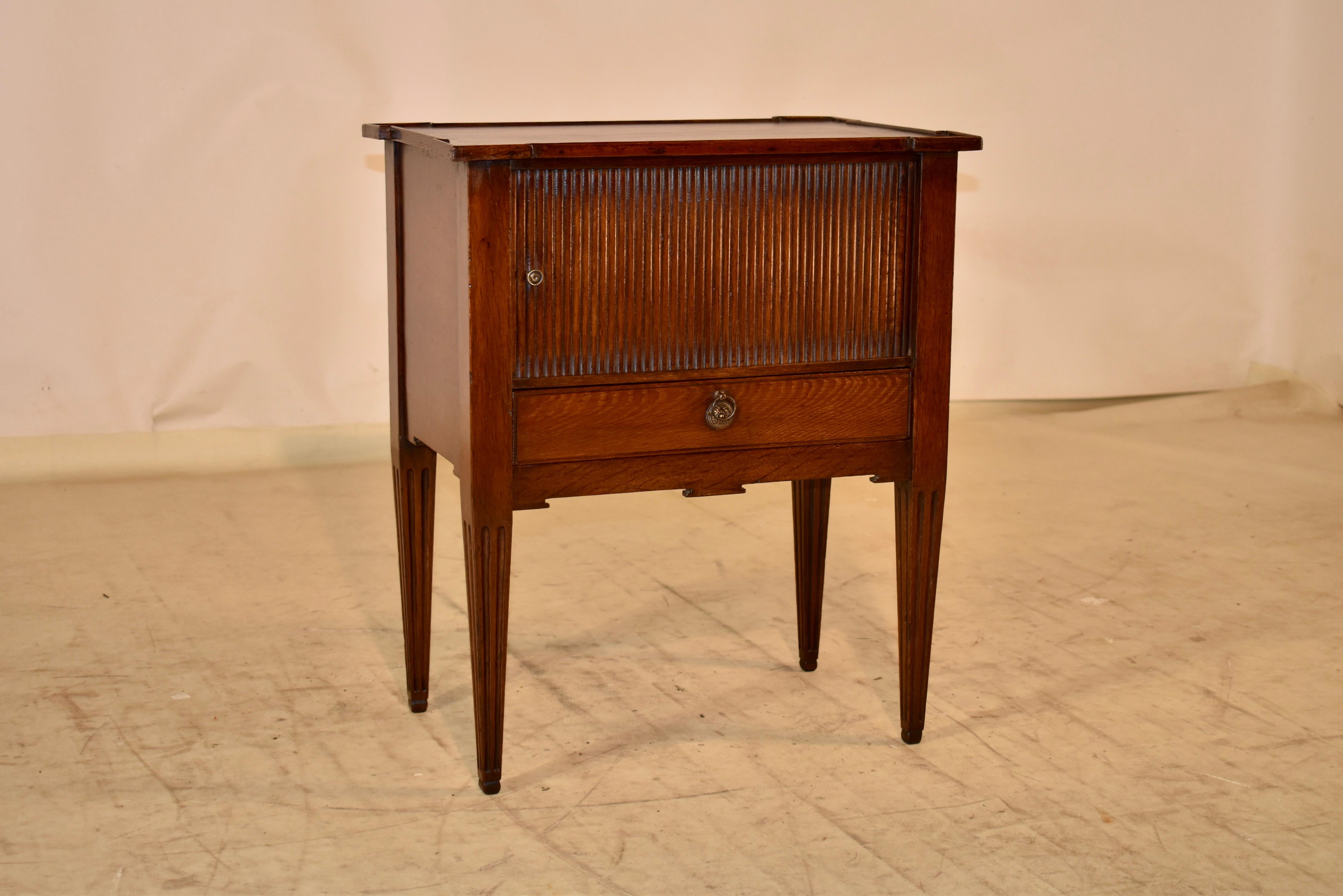 Early and rare early 19th century Georgian bedside cupboard made from mahogany. The top is banded along the edges, for a slight gallery effect around the shaped top, which adds a lot of pizazz to the overall shape of the piece.  The top follows down