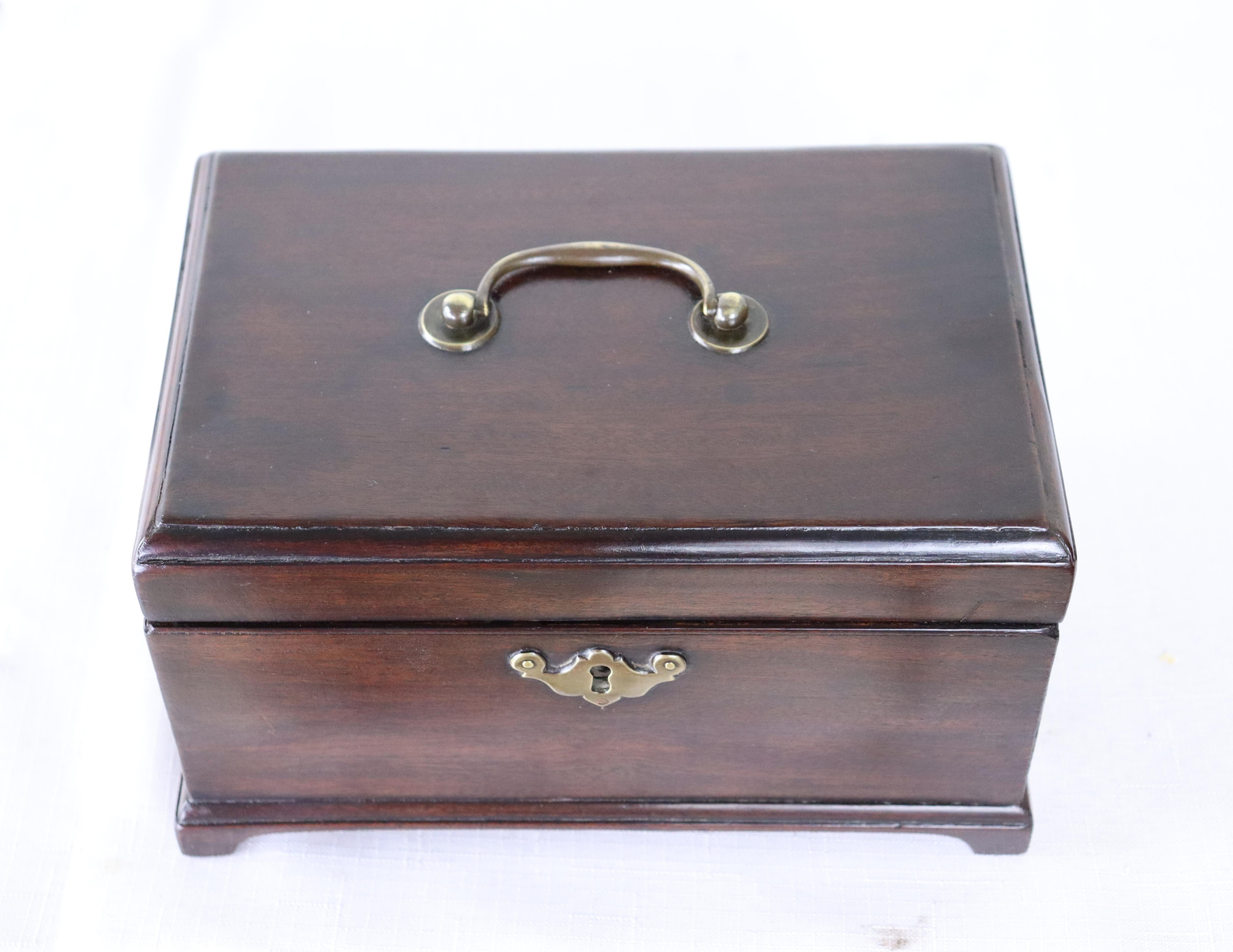 A splendid early mahogany tea caddy on charming shaped feet, circa 1770. Good color and patina and in very nice antique condition. No key.