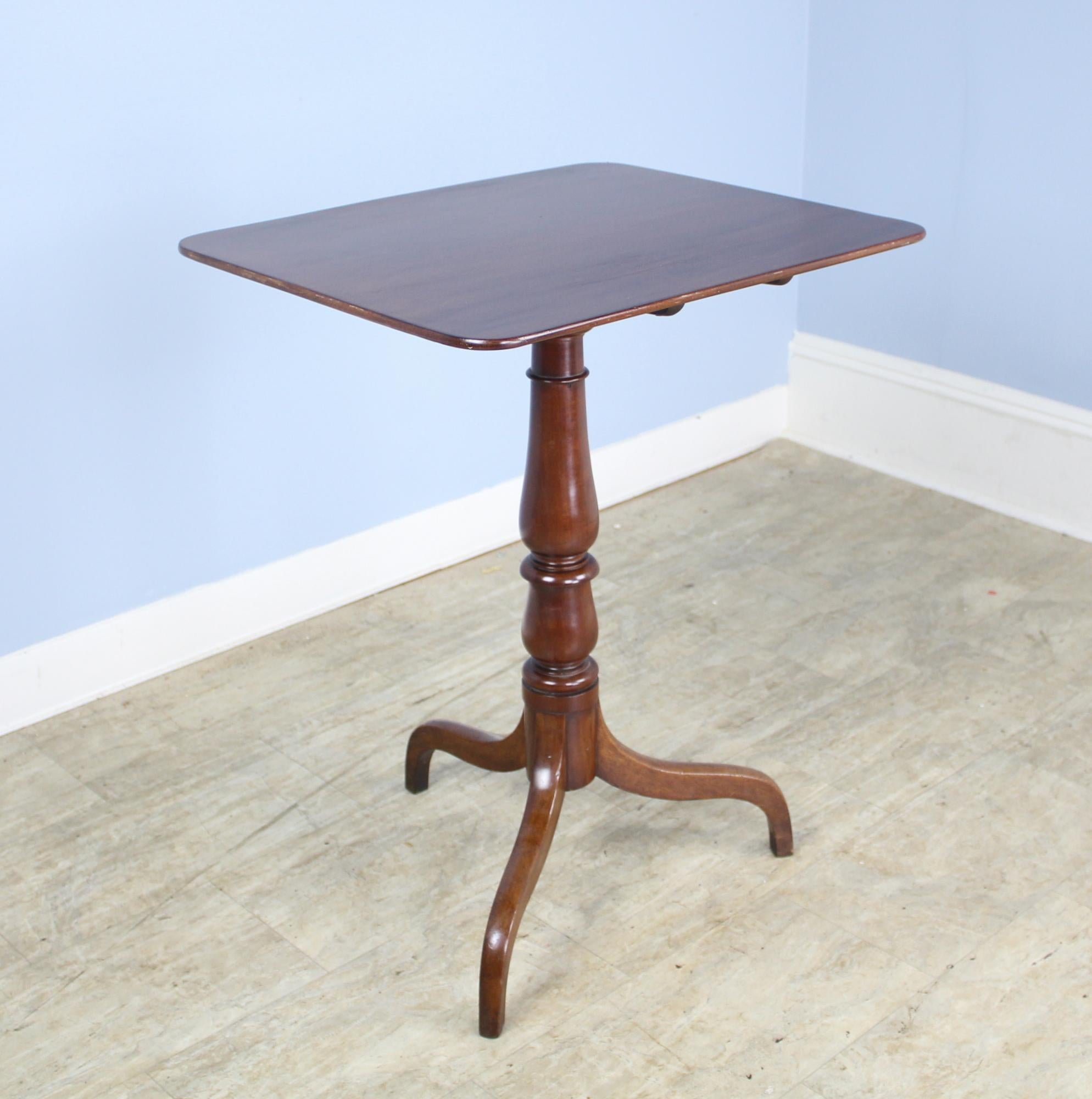 A refined and elegant tilt-top mahogany occasional table, quite early. Both the tabletop and the tilting mechanism are in very good antique condition, the top having received a light refinishing. The tripod base is sturdy and has a nice color and