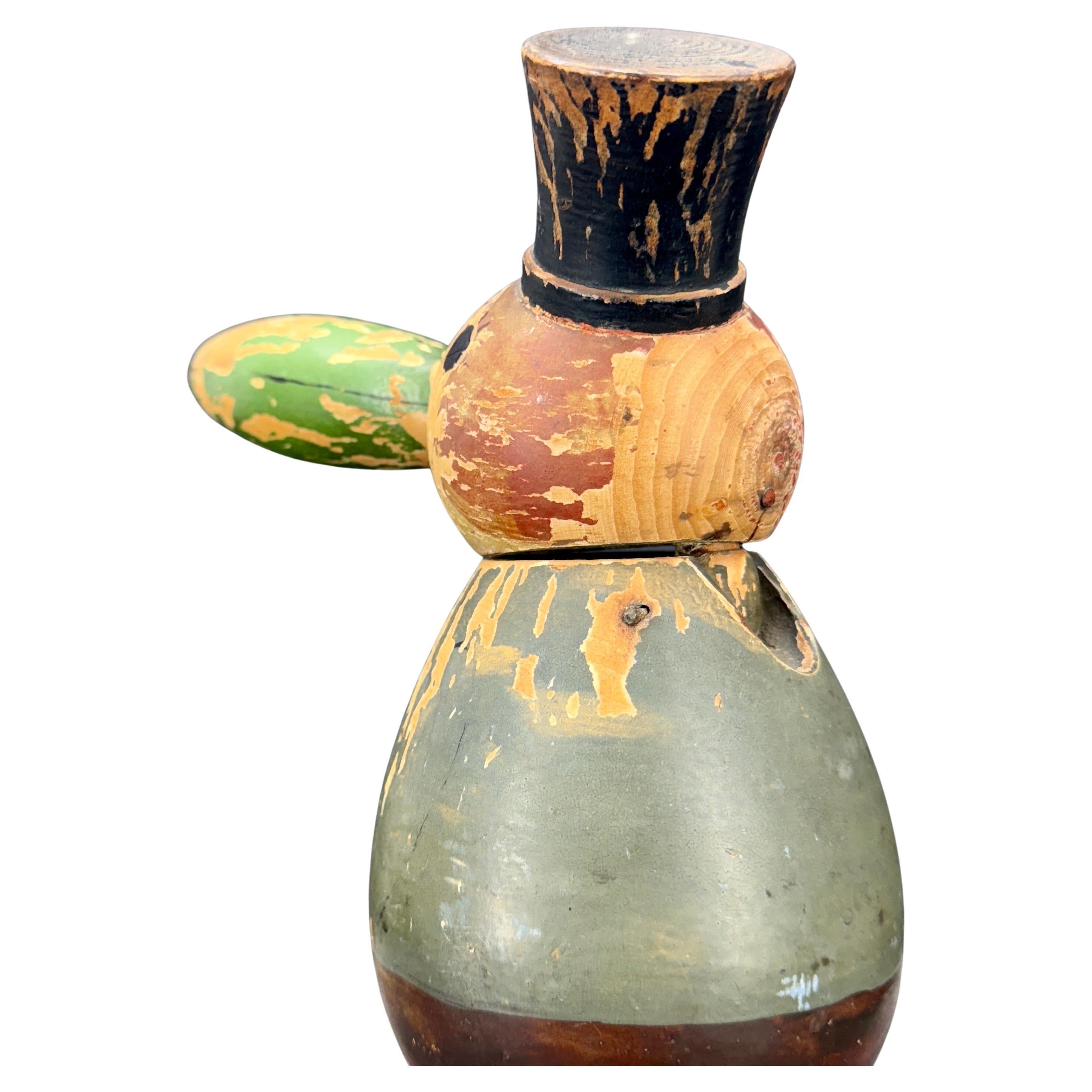 Classic German Nutcracker Figure from the 1930's. This nutcracker features a charming guy with a black top hat and a long nose similar to Pinocchio. This vintage nutcracker is very much a decorative item and certainly is a wonderful piece to add to