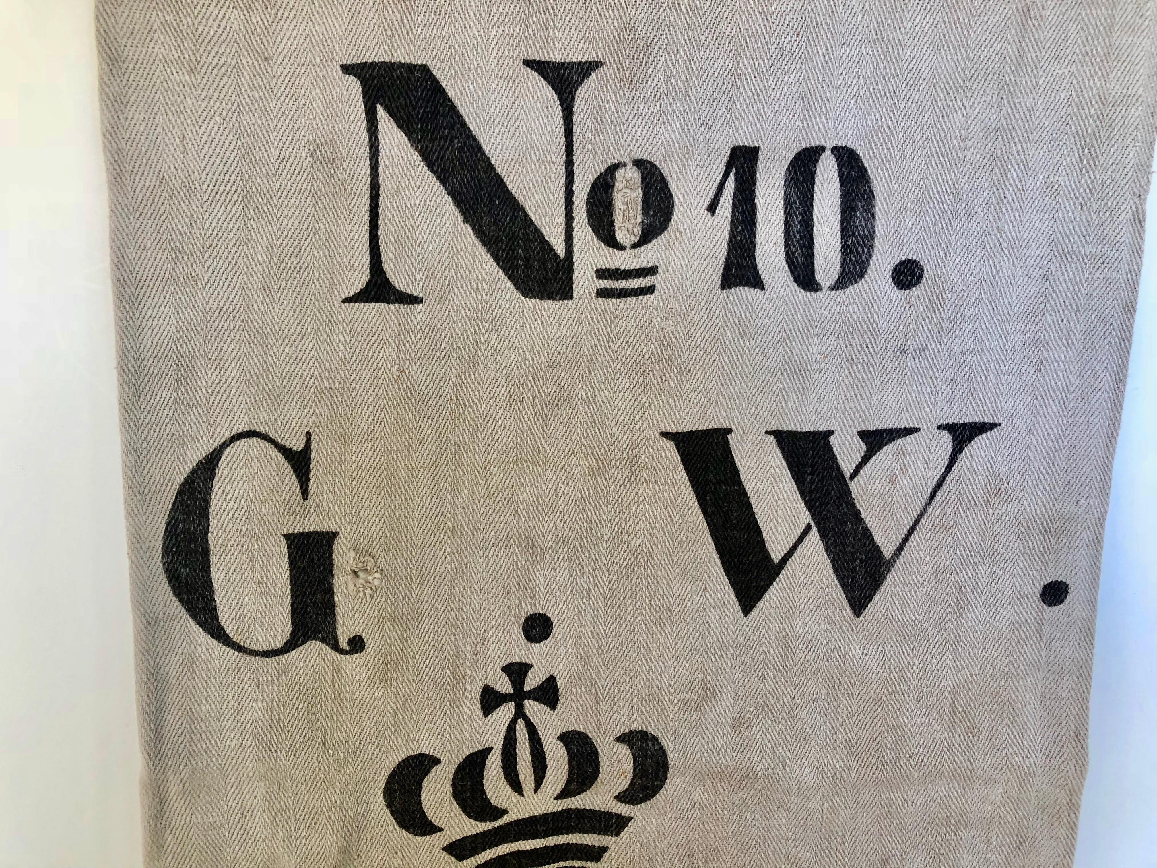 Early German handwoven grain sack with original calligraphy and graphics. It was made from linen and hemp by the farmer's wife and used to store grains. Initials identified the owner with original rare graphics and the inventory number stamped in