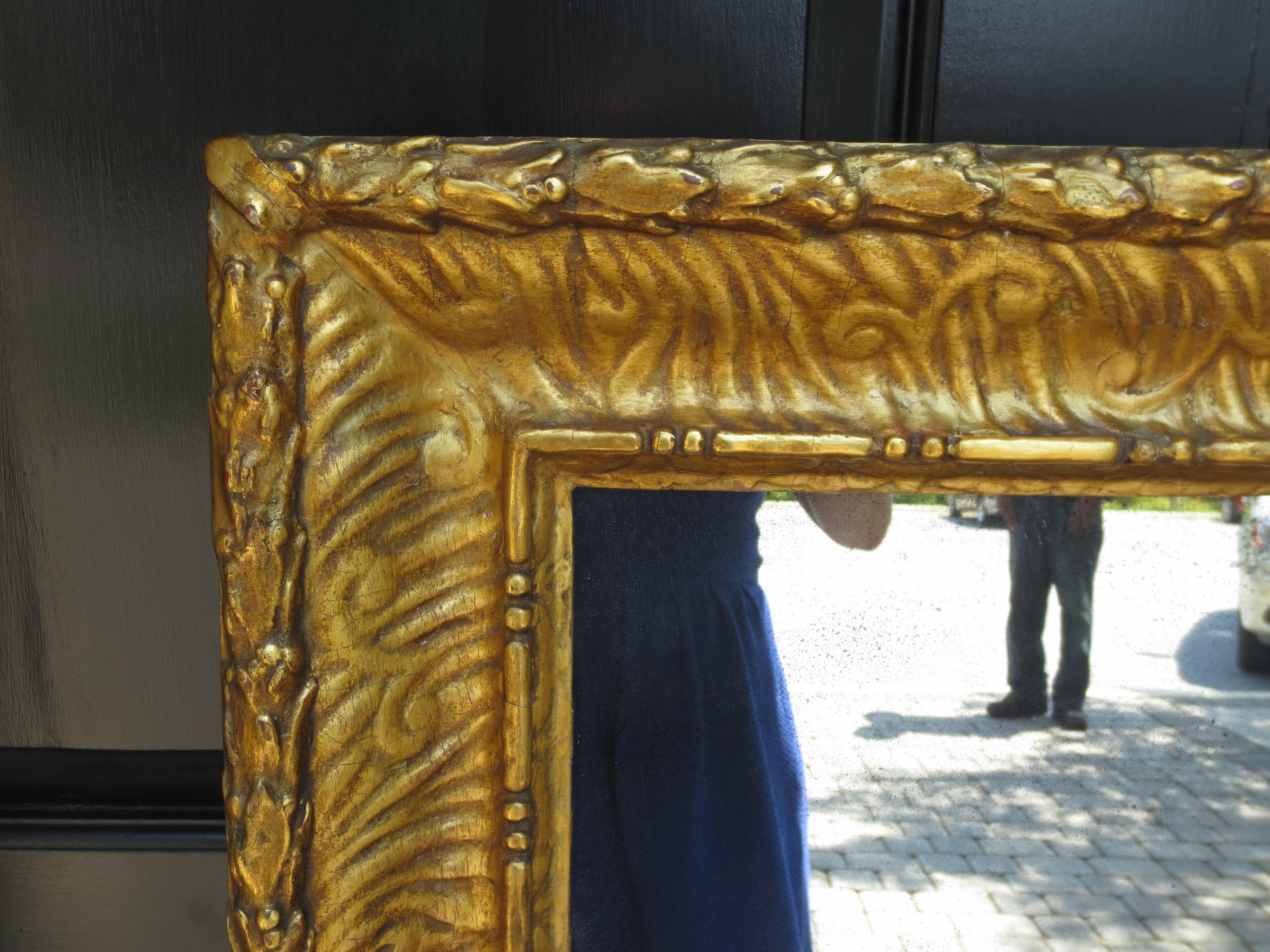 Early giltwood frame as mirror.