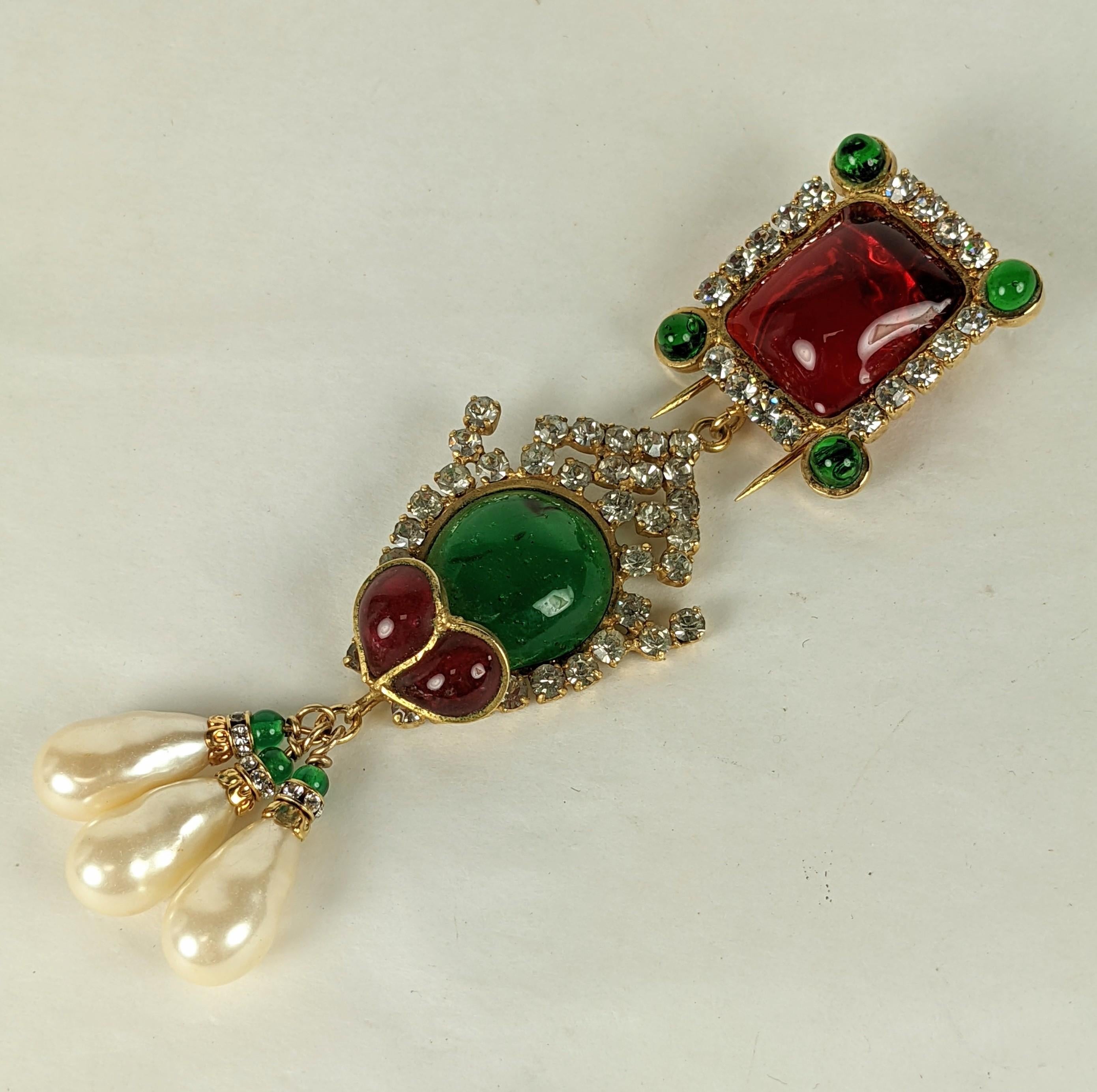 Early Maison Gripoix for Chanel articulated Renaissance pendant brooch circa 1960. Of Gripoix poured glass enamel in emerald and ruby, glass beads, cut crystal rondelles and faux baroque pearls set in gilt plate bronze and brass metals.
Clip back