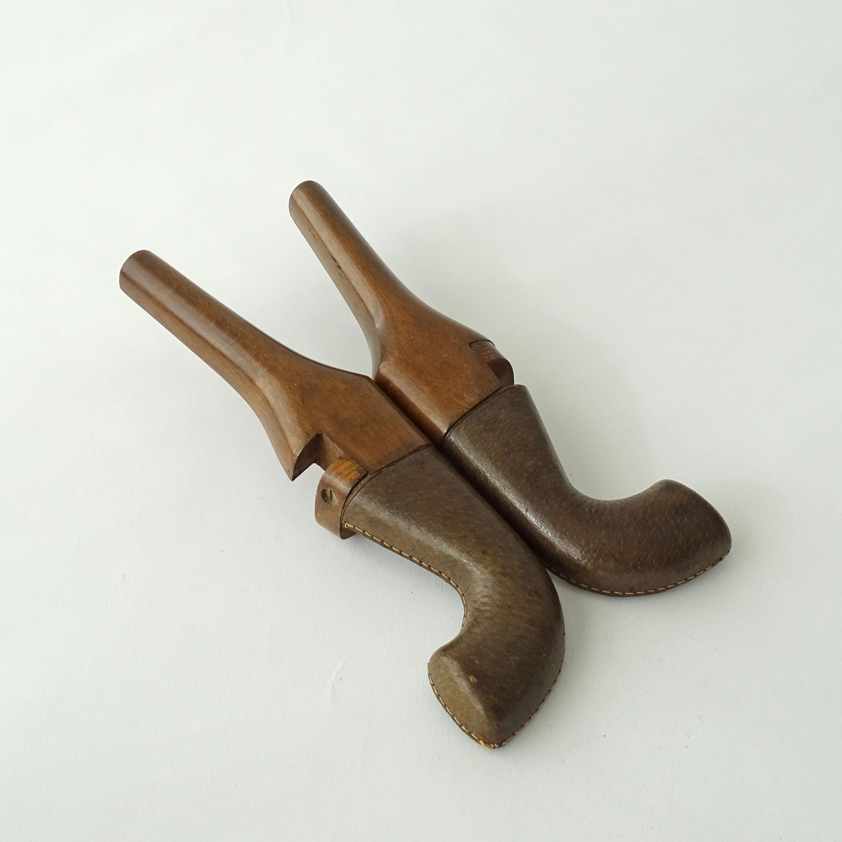 Unusual and early Gucci gun shaped foldable boot jack, Italy 1950s