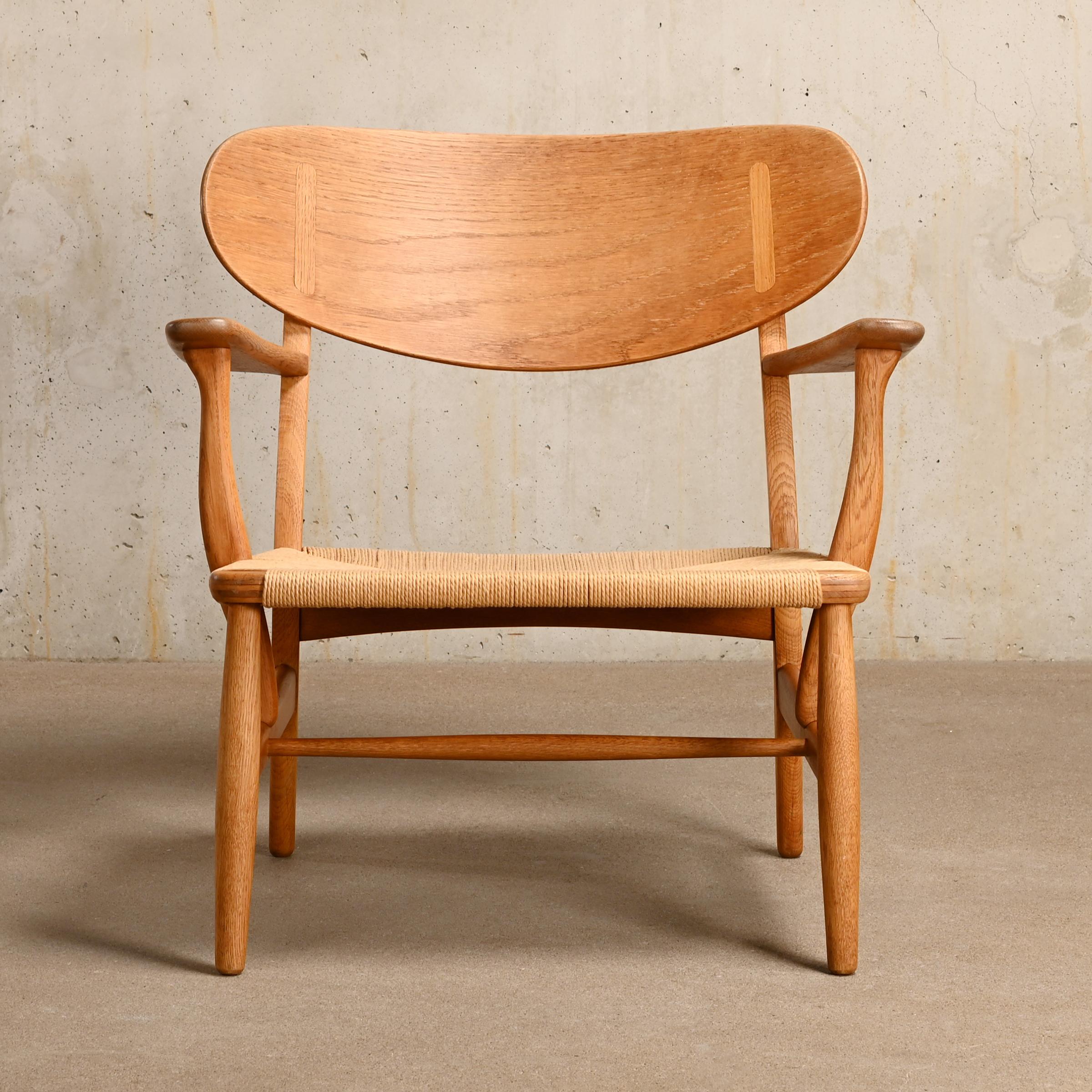 The beautiful and elegant CH22 Easy Chair is one of the many design icons by Hans J. Wegner for Carl Hansen & Son, Denmark designed in 1950. Great collaboration between aesthetics, craftsmanship and use of materials resulting in a well proportioned