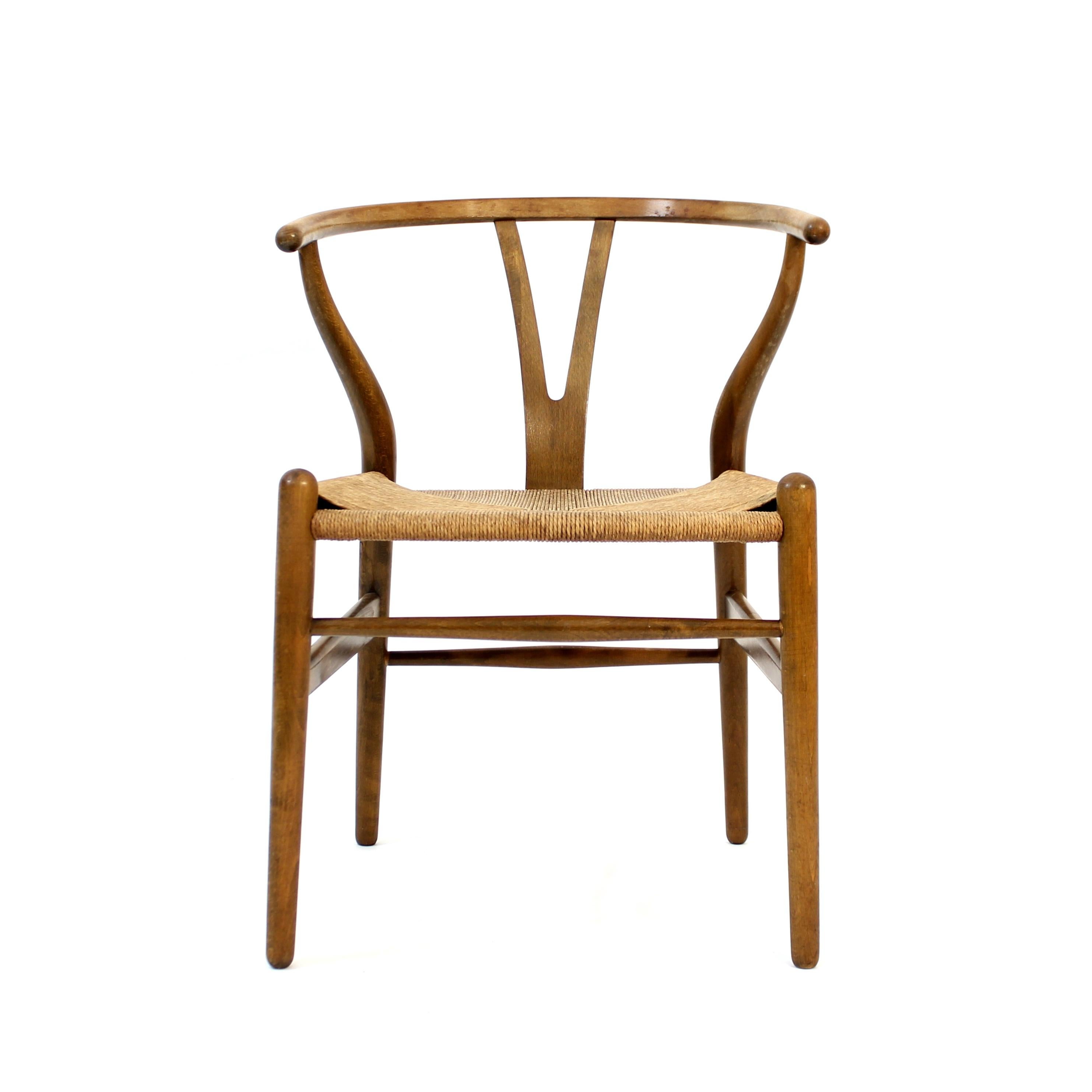 Early example of the iconic Wishbone chair (or the Y-chair as it also is called), designed in 1949 by Hans J. Wegner for Carl Hansen & Søn and was put into production from 1950 and forward. The official model name is CH24. The frame on this early
