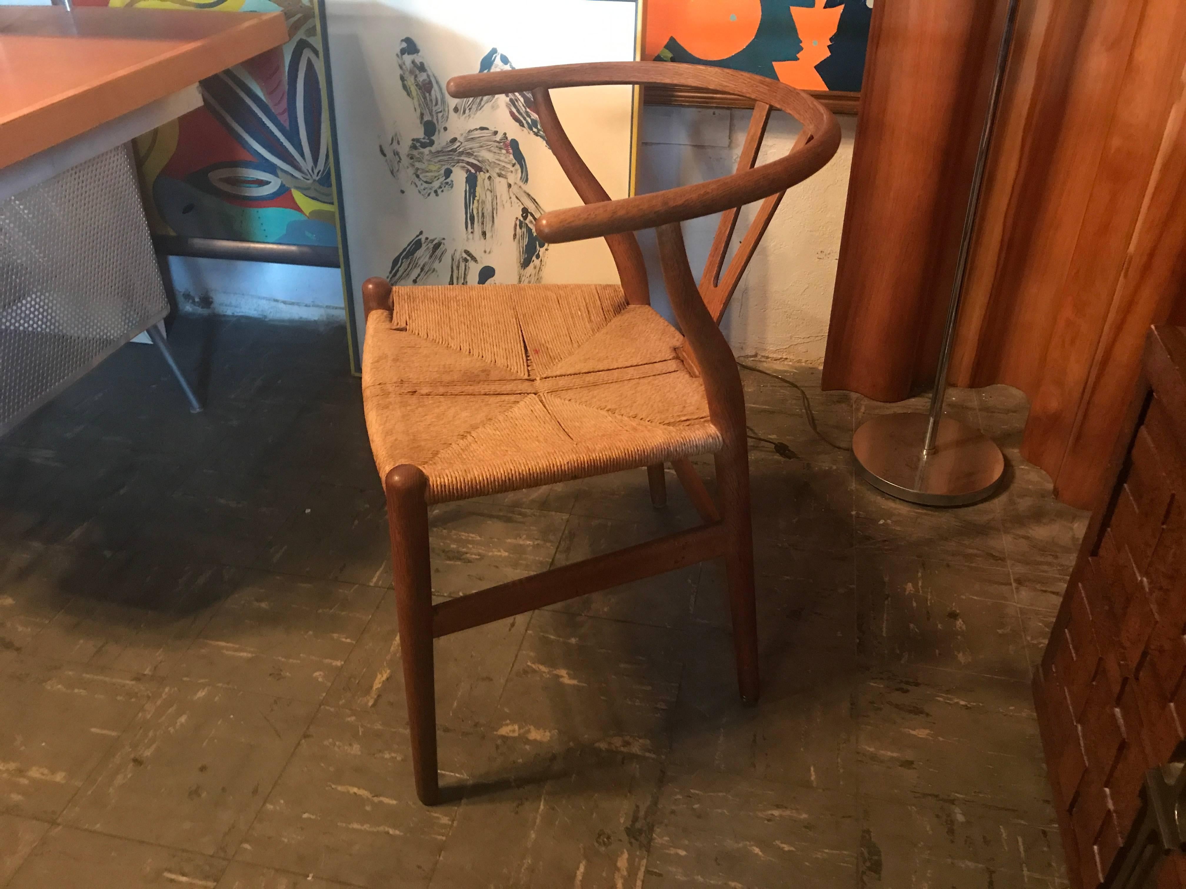 Early vintage wishbone chair
has wear from age but structurally solid.

      