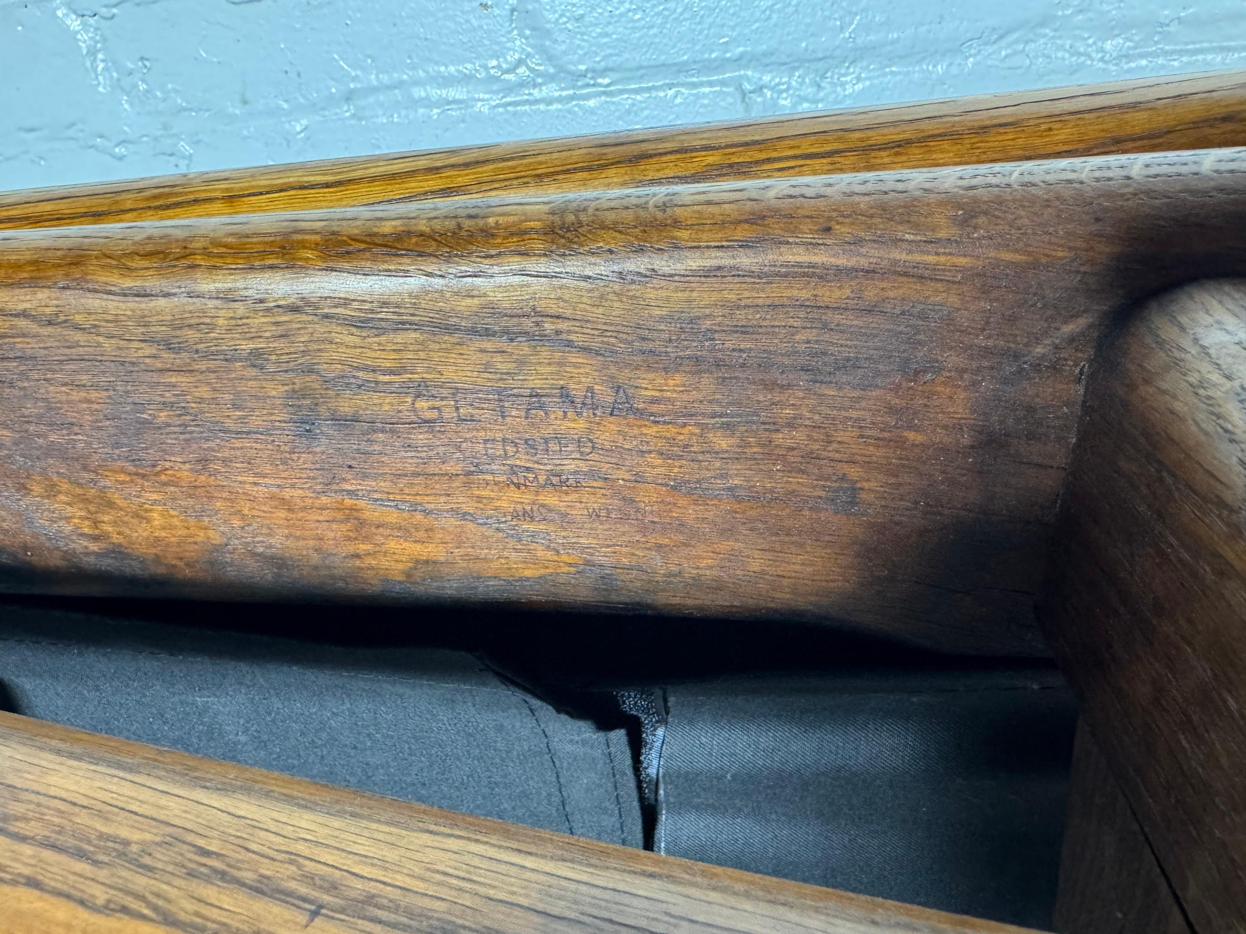 This rare and early chaise longue was designed by Hans Wegner in 1954.Classic Scandinavian Modernist Design,  Crafted from solid oak with brass hinges and iron hardware, this versatile chaise can be a reclining chaise, a separate reclining chair