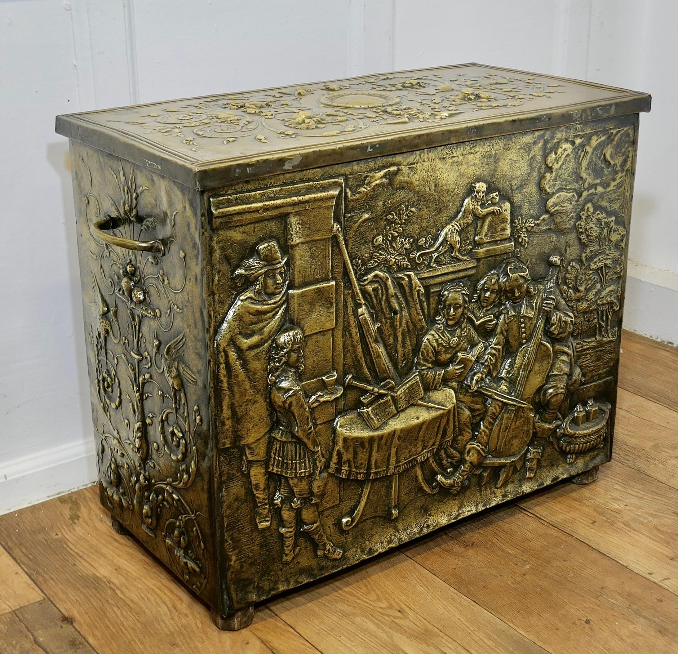 Early Heavily Embossed Brass Box

This is a large and heavy chest is made in Brass with a wooden lining, the beaten brass is embossed with decorative gothic decoration and on the front a very detailed domestic setting, with a family music tableau