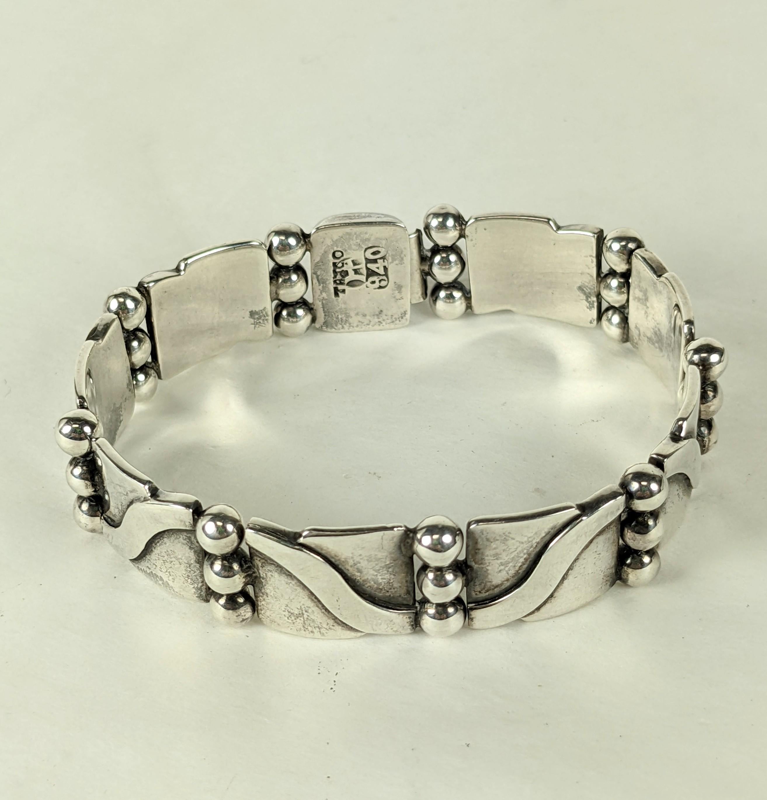 Timeless early Hector Aguilar Link Bracelet from the 1940's. High Art Deco styling with ingenious ball link hinges and undulating wavey design motif would look great on anyone. 7