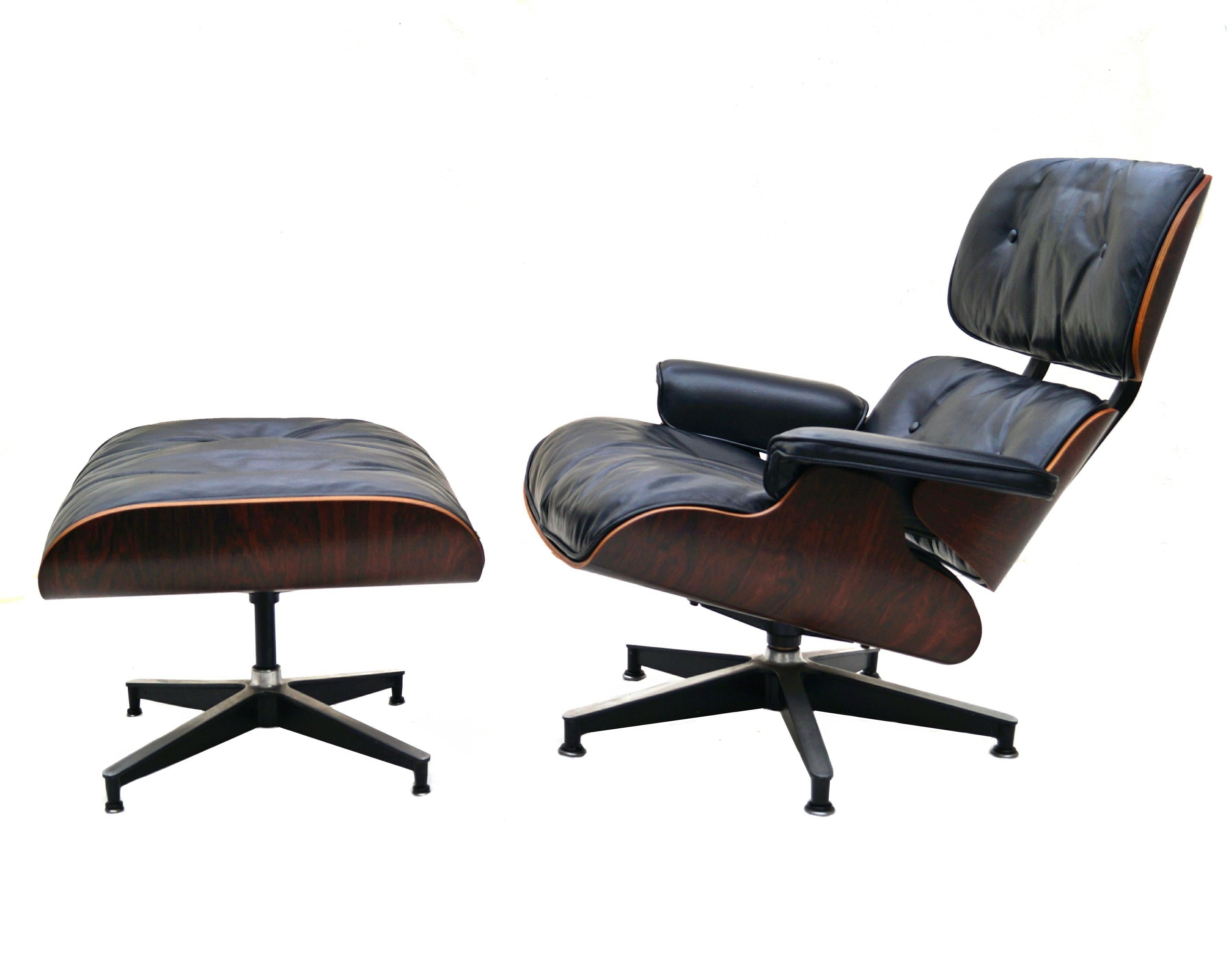 Early Herman Miller rosewood Charles & Ray Eames black leather lounge chair and ottoman. Grey Duck feathers/ down. Also has Latex. Latex label is loose. All wood pieces are marked 953 with a 3 below. Has older clips and black circle Herman Miller