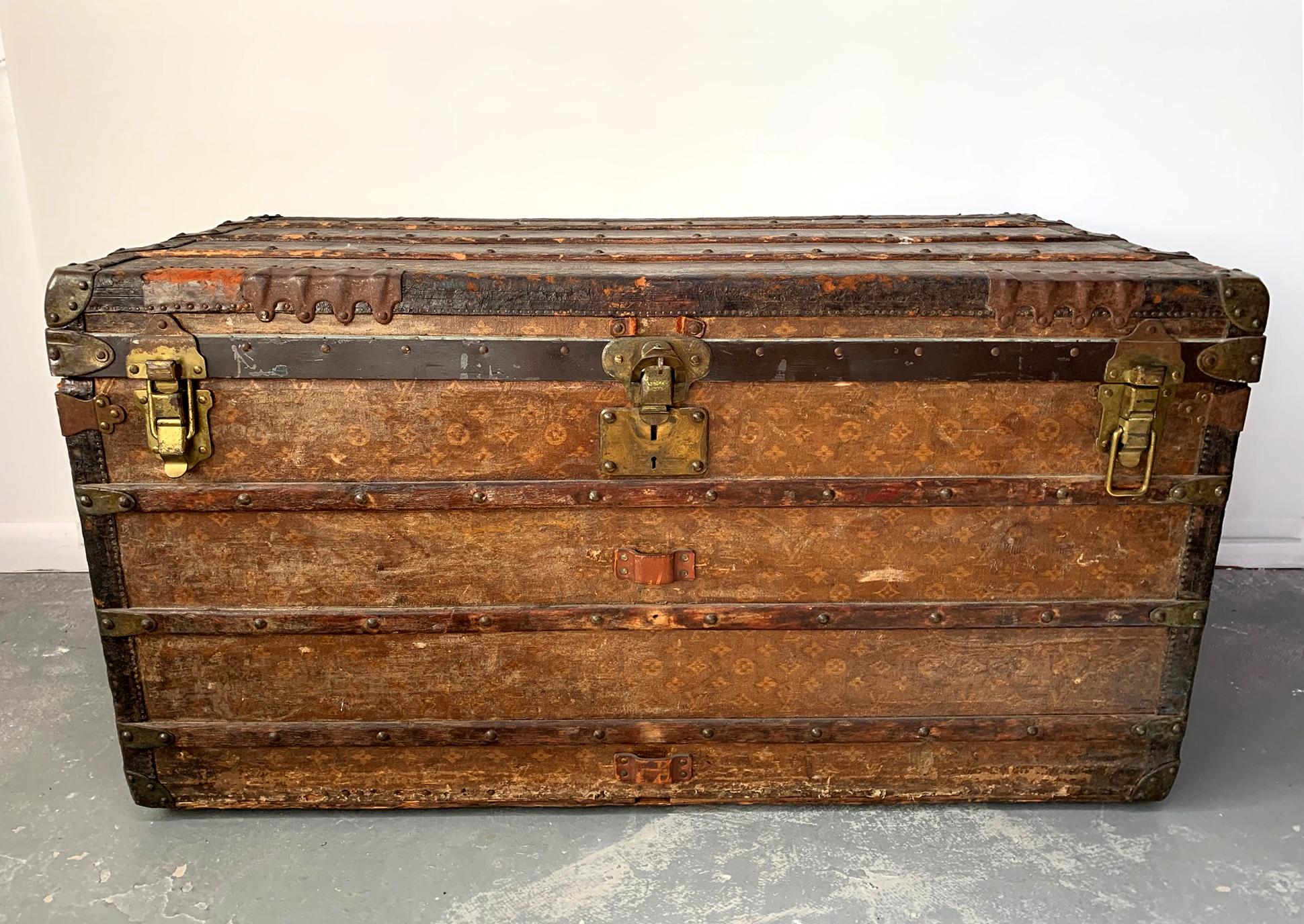 A large vintage Louis Vuitton steamer trunk. Early production from turn of the century (after 1896 with the presence of the LV logo, and likely before 1910). From the descendants of James J. and Mary T. Hills. James Jerome Hill (1838-1916), was a