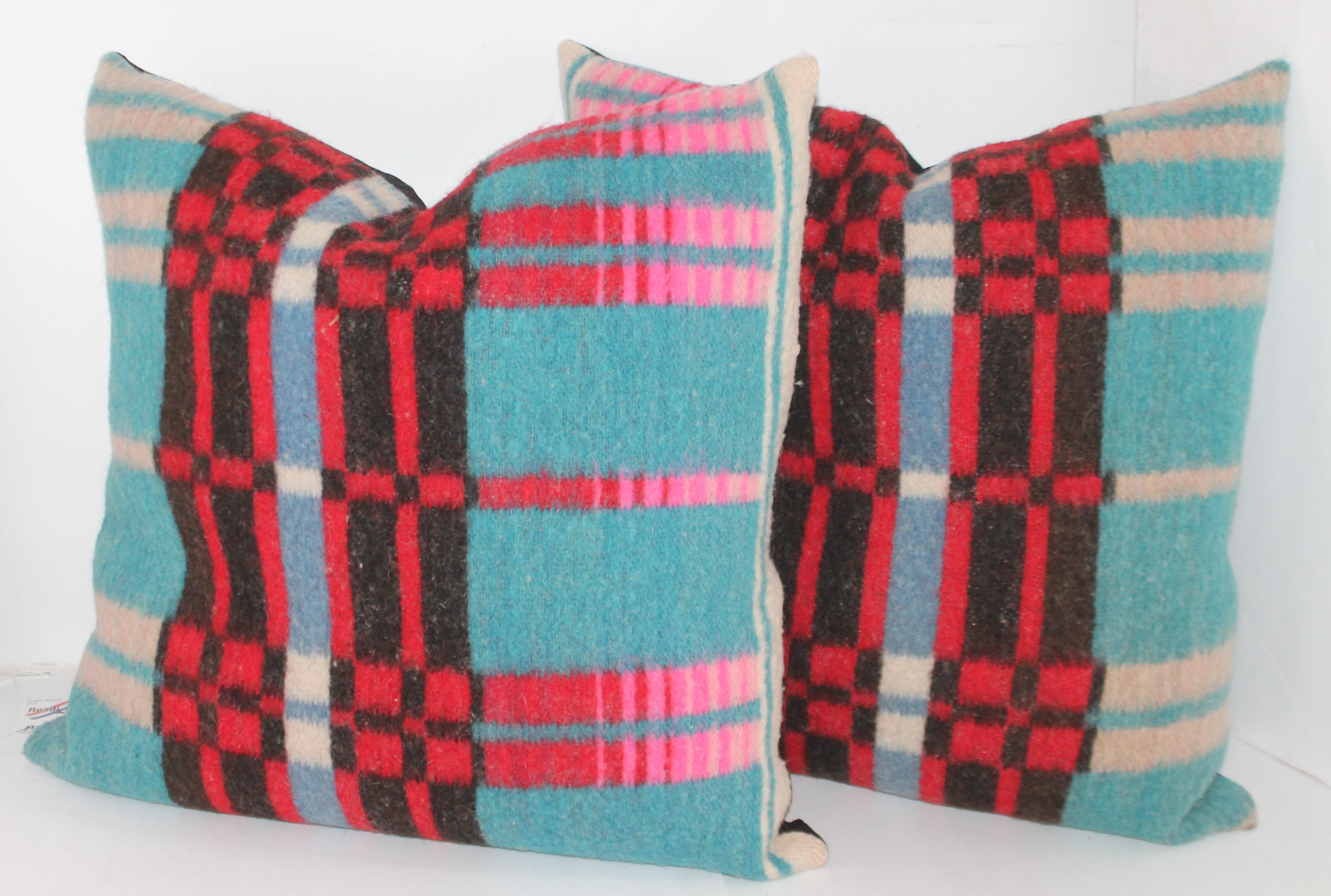 These amazing and early wool horse blanket pillows are in pristine condition and sold as a group of four. The backings are cotton linen.