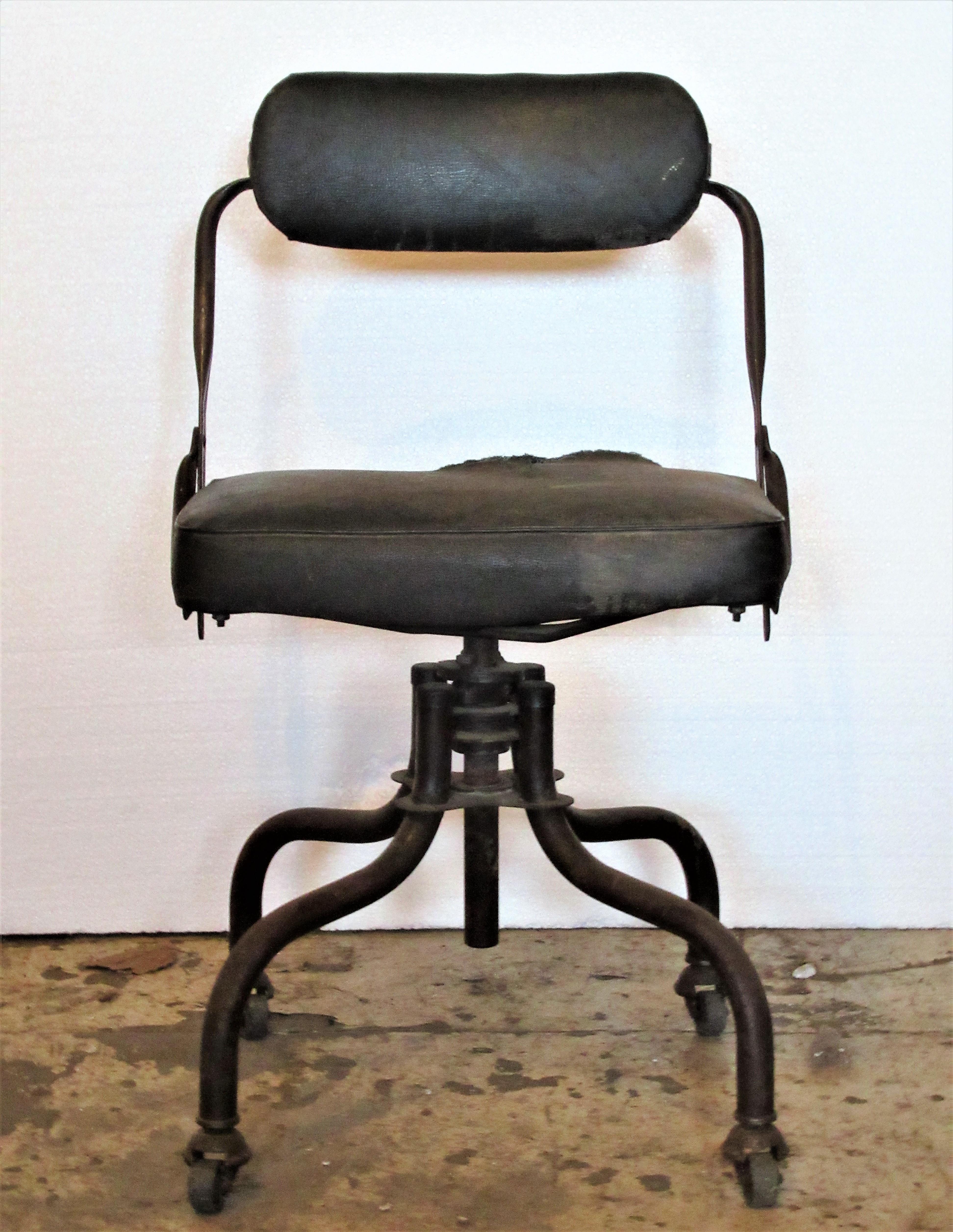 Antique American industrial rolling swivel desk task chairs by Domore Chair Company in original vintage condition. Taller chair measures 31 inches high x 20 inches to seat / lower chair measures 29 inches high x 18 inches to seat (dark green oil