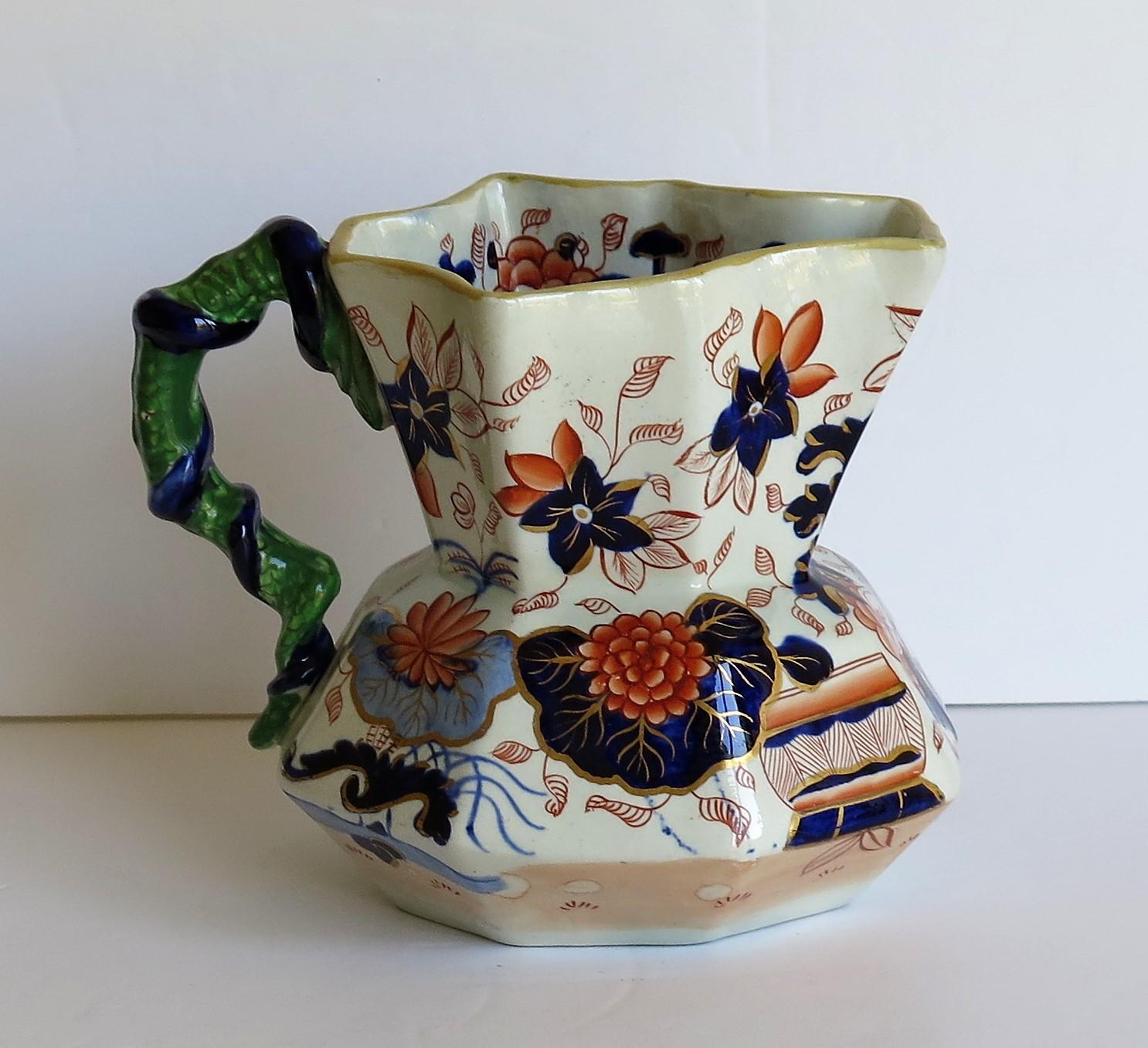 This is a very good, early Staffordshire Potteries Ironstone Hydra jug in the Japan Basket pattern with an unusual intertwined snake handle, circa 1820-1825, English late Georgian period.

The jug has an octagonal shape with a very unusual handle of