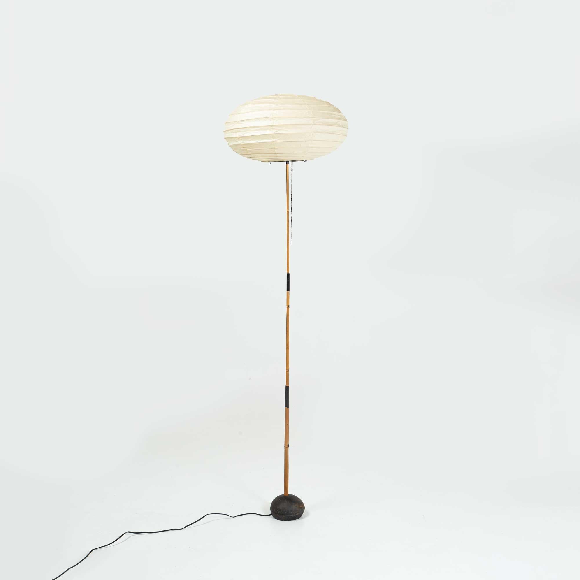 A vintage Isamu Noguchi Akari floor lamp, model BB3-50EN, circa 1960s. Bamboo and enameled steel with a paper shade. The paper shade is newer and is in excellent condition for its age, with minimal wear and tears, no holes.

.