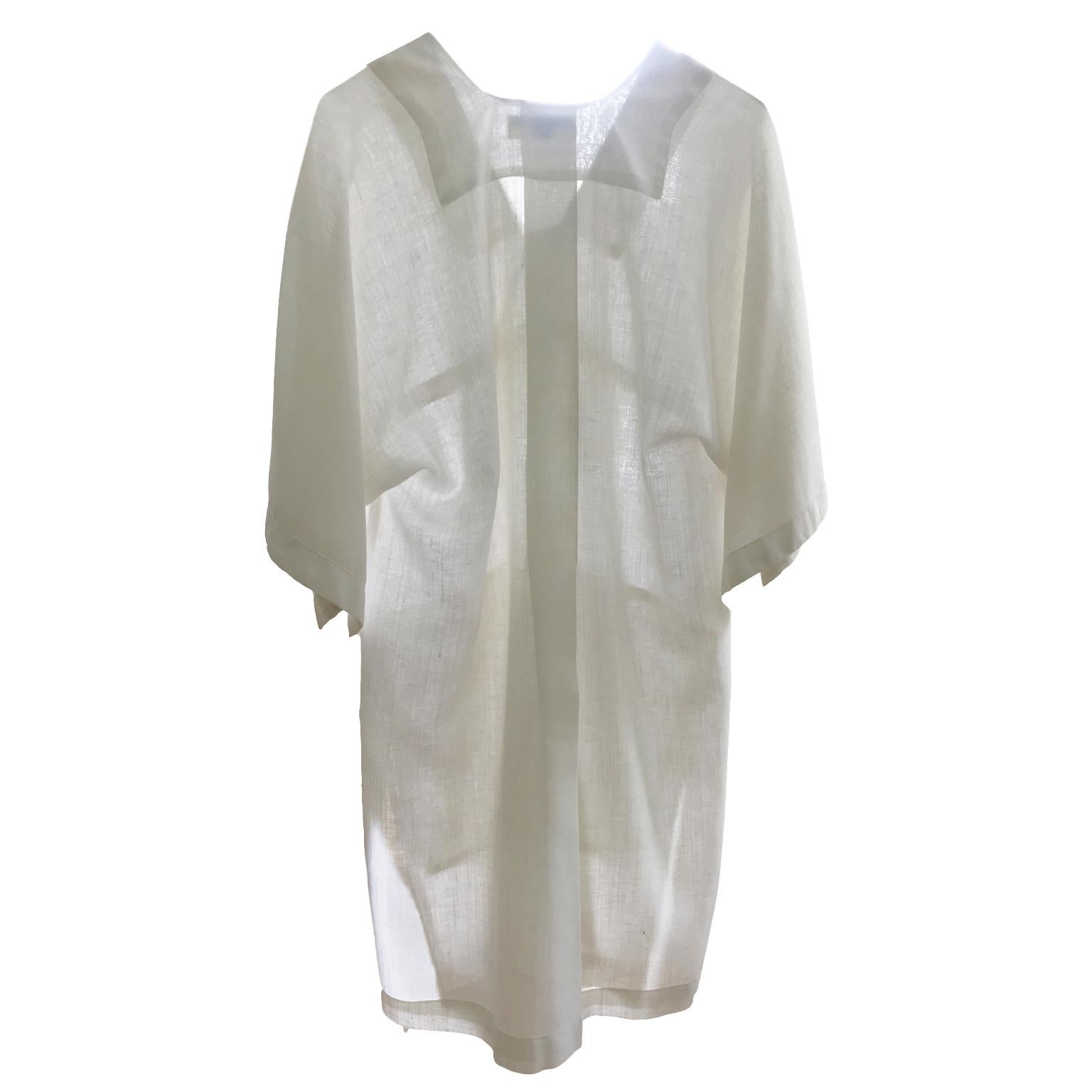 Issey Miyake kaftan / Dress Shirt from circa 1973. Rare find early Issey Miyake piece.
Dolman sleeve :  47 cm (from neck point)
Length back : 88 cm
Width : 49 cm


