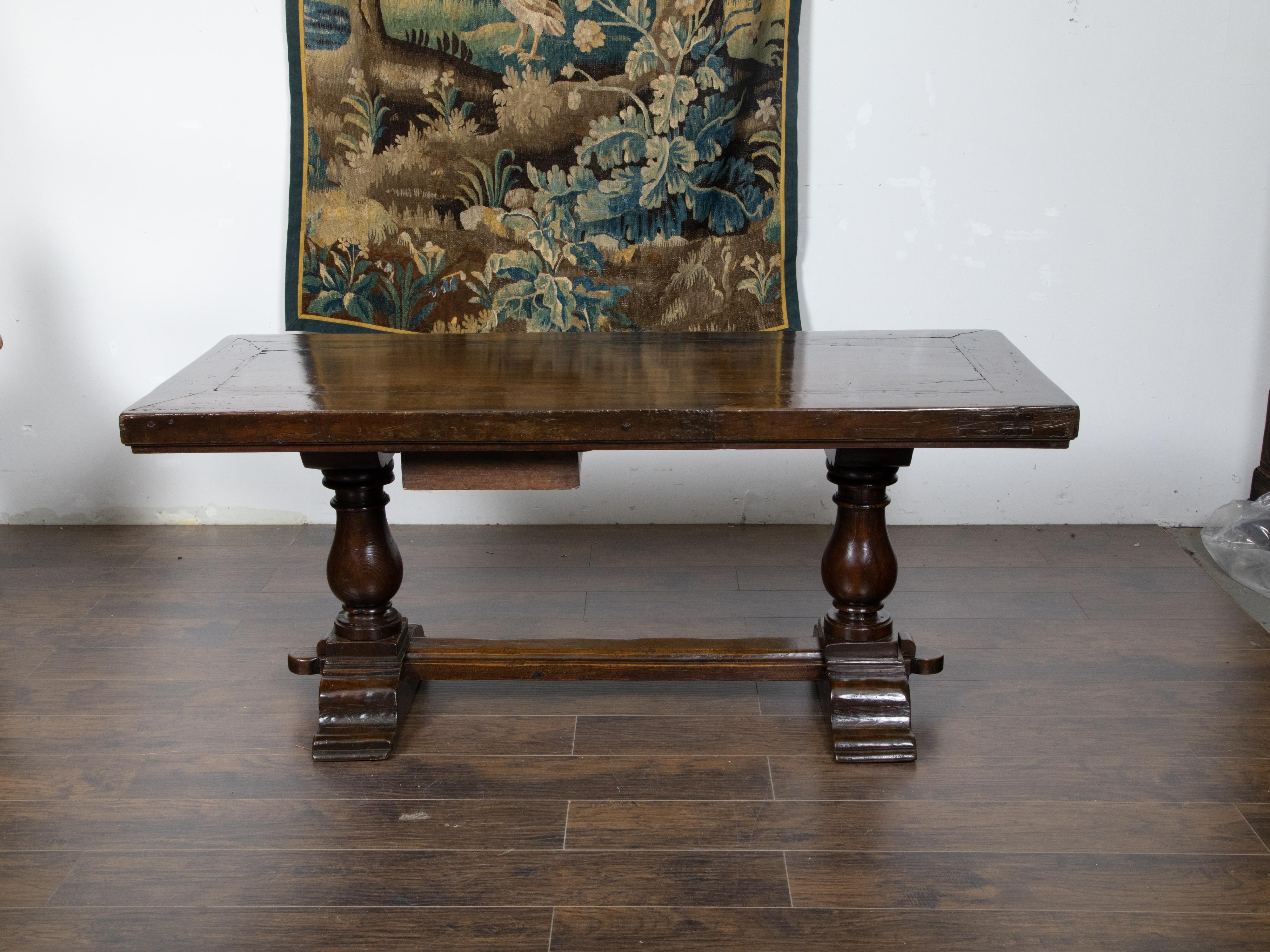 Turned Early Italian 19th Century Walnut Table with Trestle Base and Single Drawer For Sale