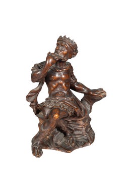 Figura scolpita di un re seduto, in stile italiano antico
