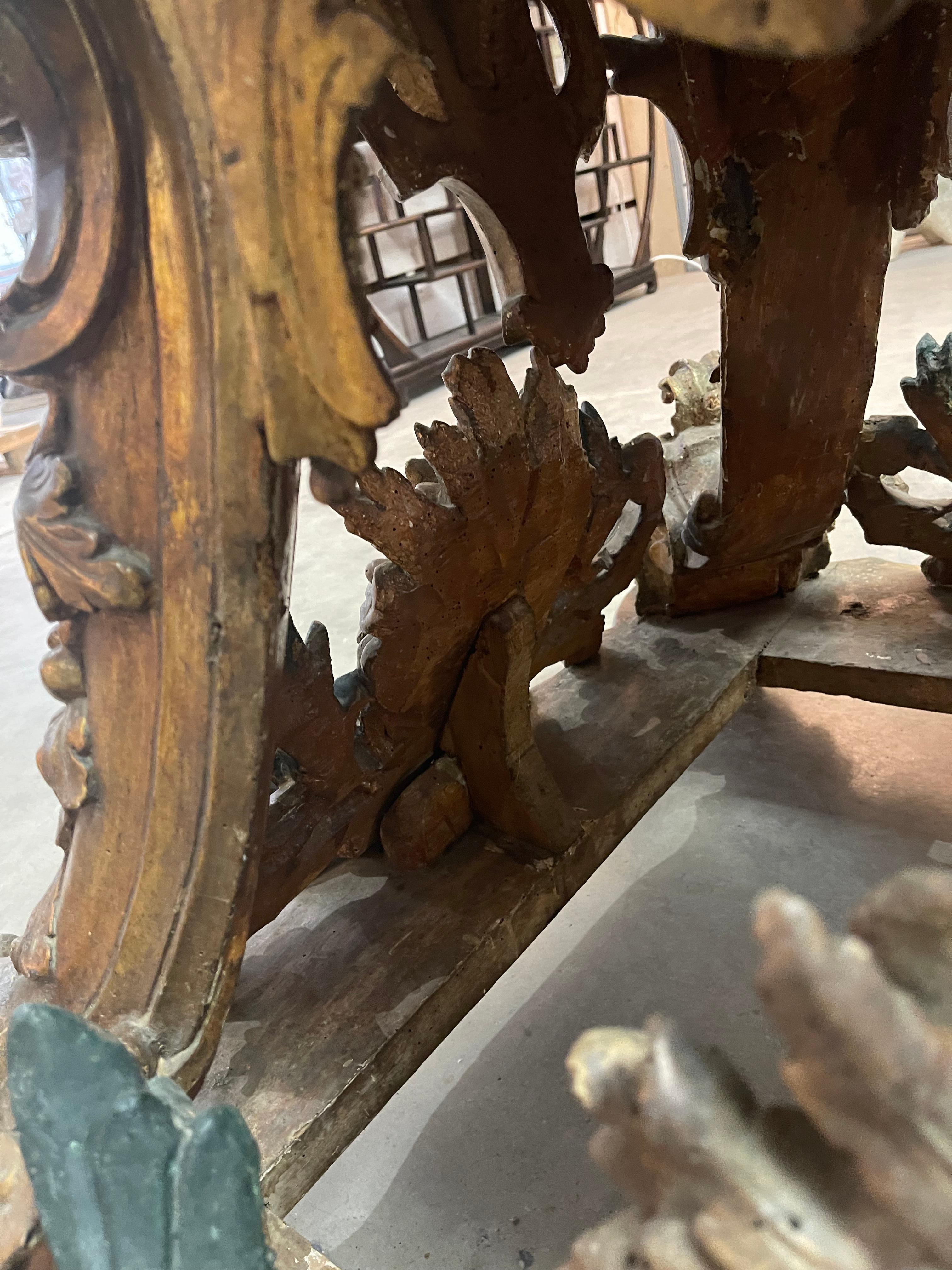 This amazing base most likely held a saint. The finish is gilt in silver and gold. It’s distressed yet stable enough to hold this large glass top.  I have listed it as early 19th century but I’m not sure its not 18th century. Regardless, its amazing