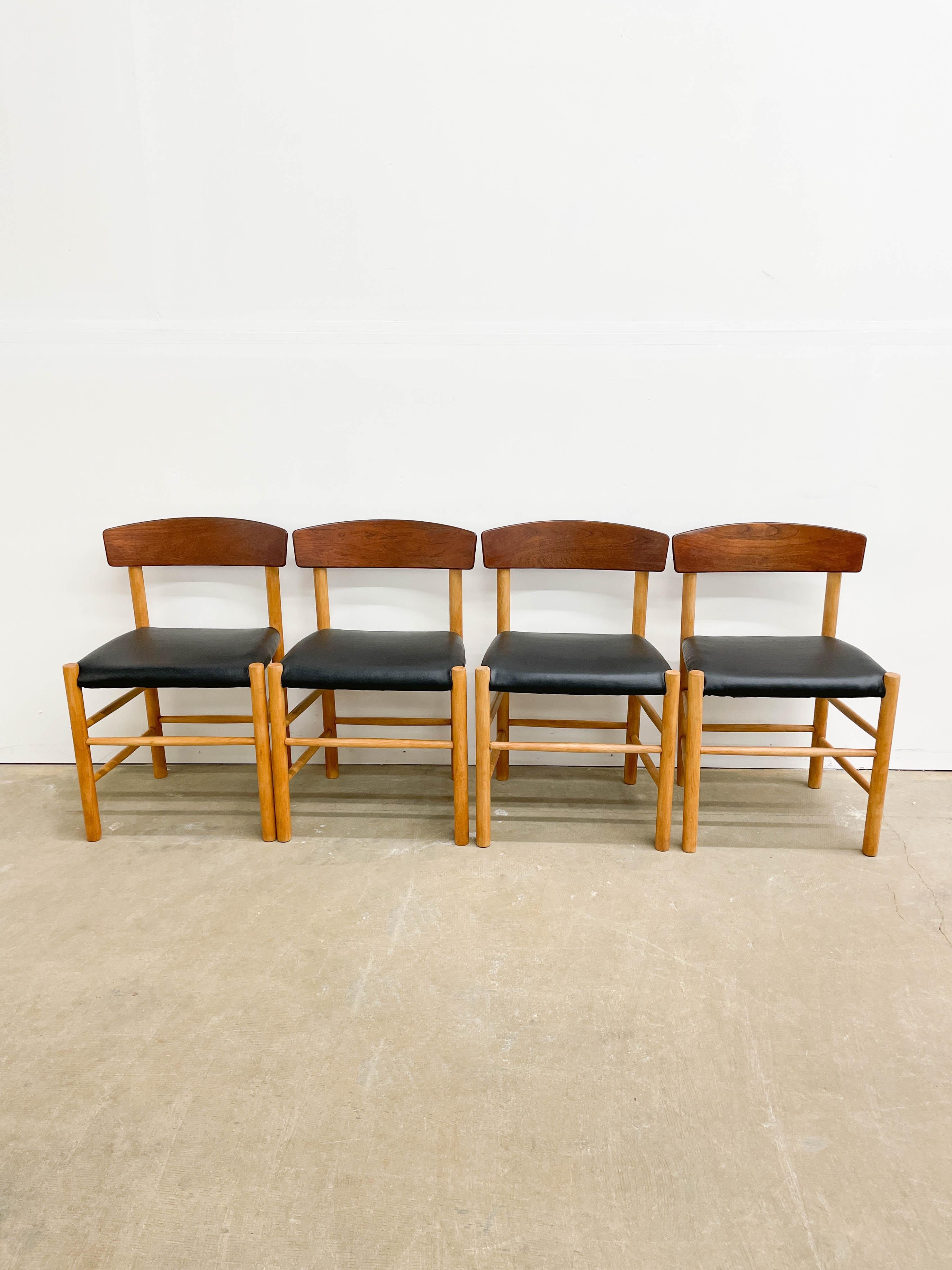 This is a spectacular and rare set of four dining chairs by Danish designer Børge Mogensen in 1947, made by FDB Møbler in the late 1940s. This is an early version of the J39 chairs with solid beech frames and steam-bent teak seat backs. They come