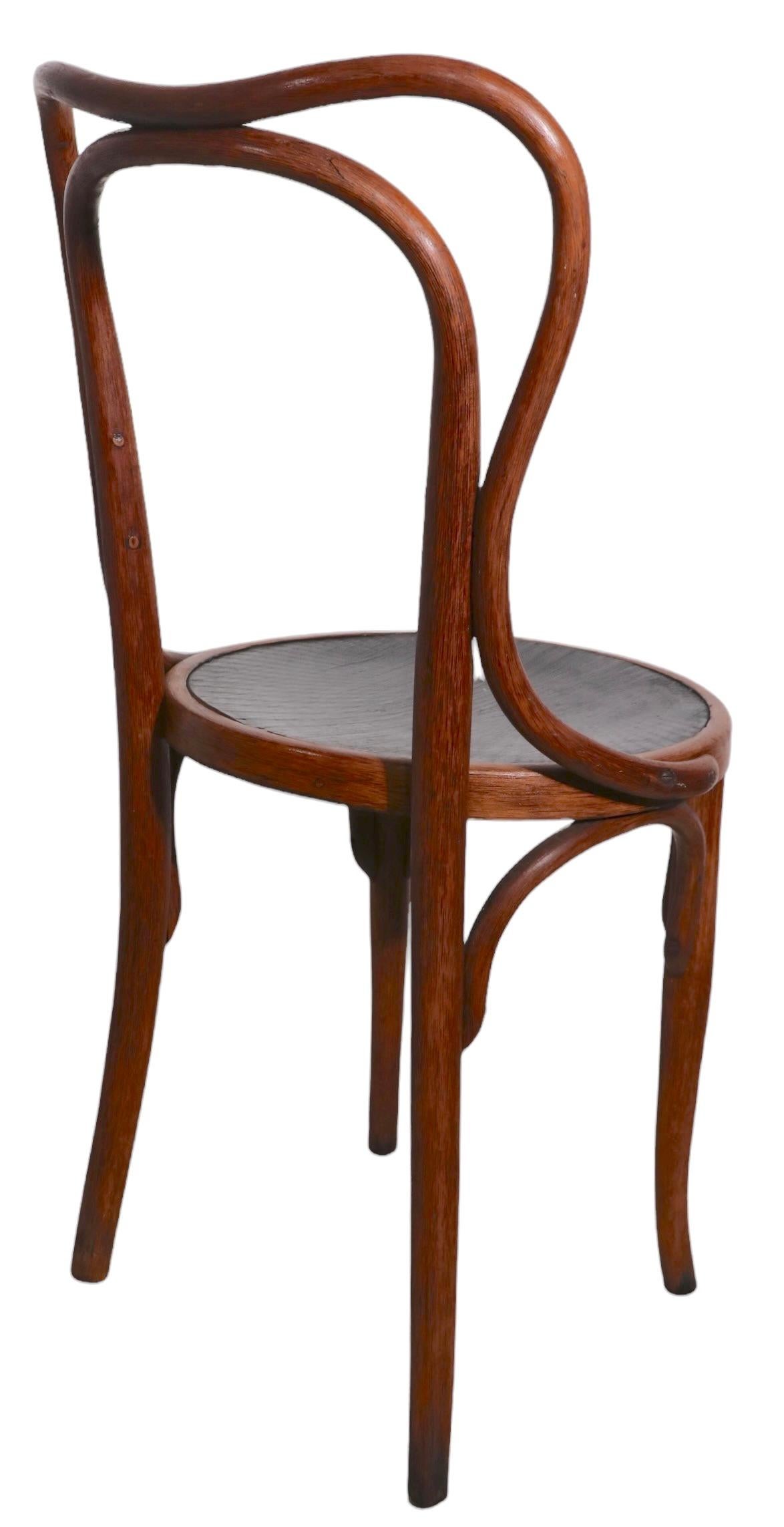 One of the more successful designs produced by J J Kohn, this chair is an early example of the Vienna Secessionist School of early modern design, produced in Austria. This example is in very fine, original, untouched condition, free of damage, or