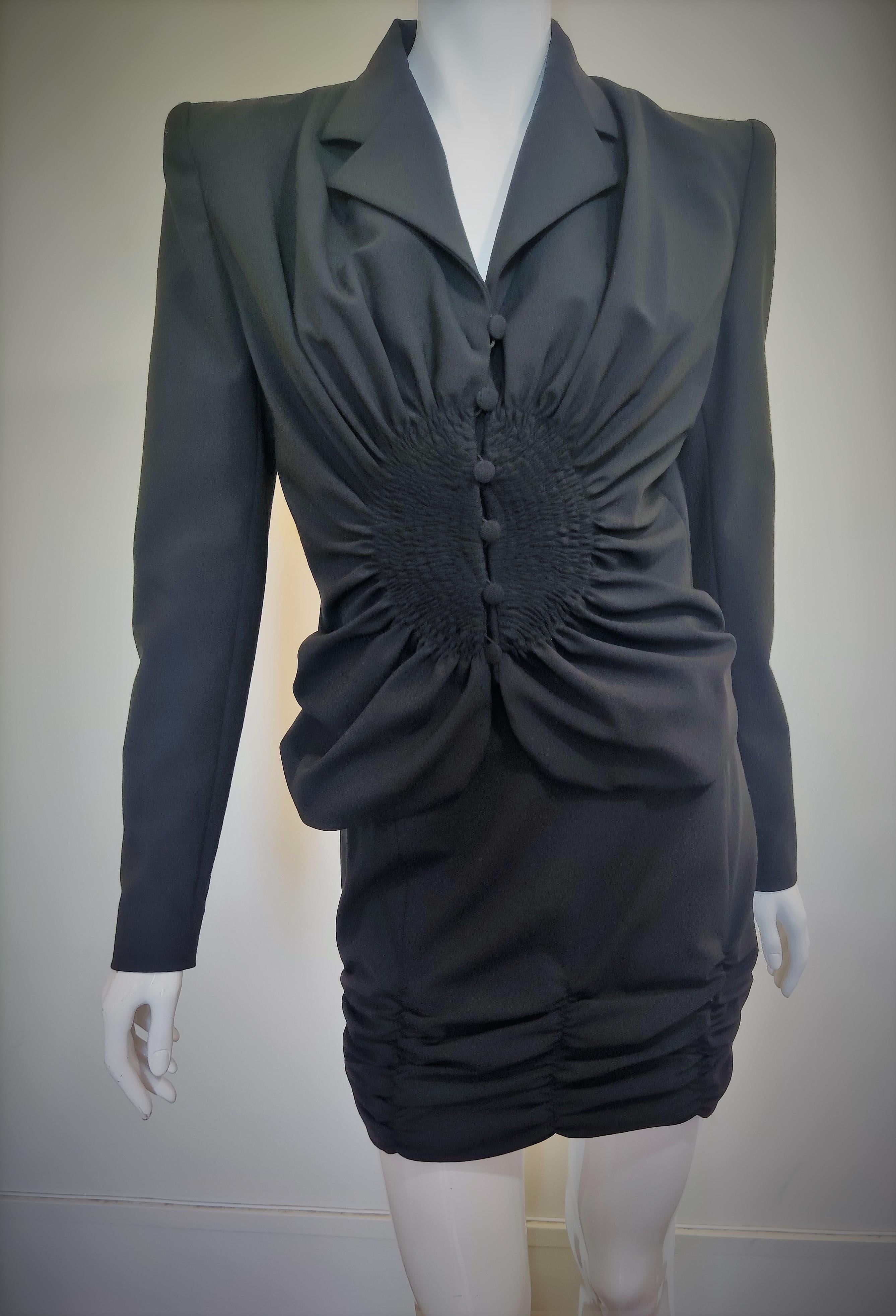 Early beautiful piece by John Galliano!
Skirt + jacket suit set!
With shoulder pads. Wide shoulder look!
Wasp waist  silhouette.

LIKE NEW condition!

Jacket is designed with pointed collar, long sleeve featuring buttoned-down fastening and ruched