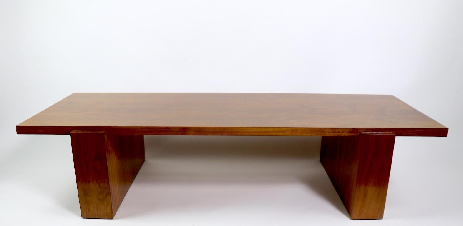 Early Kagan Dreyfus coffee table in walnut. Hard to find form, sophisticated, chic and stylish design. This example is newly professionally refinished and in mint condition.