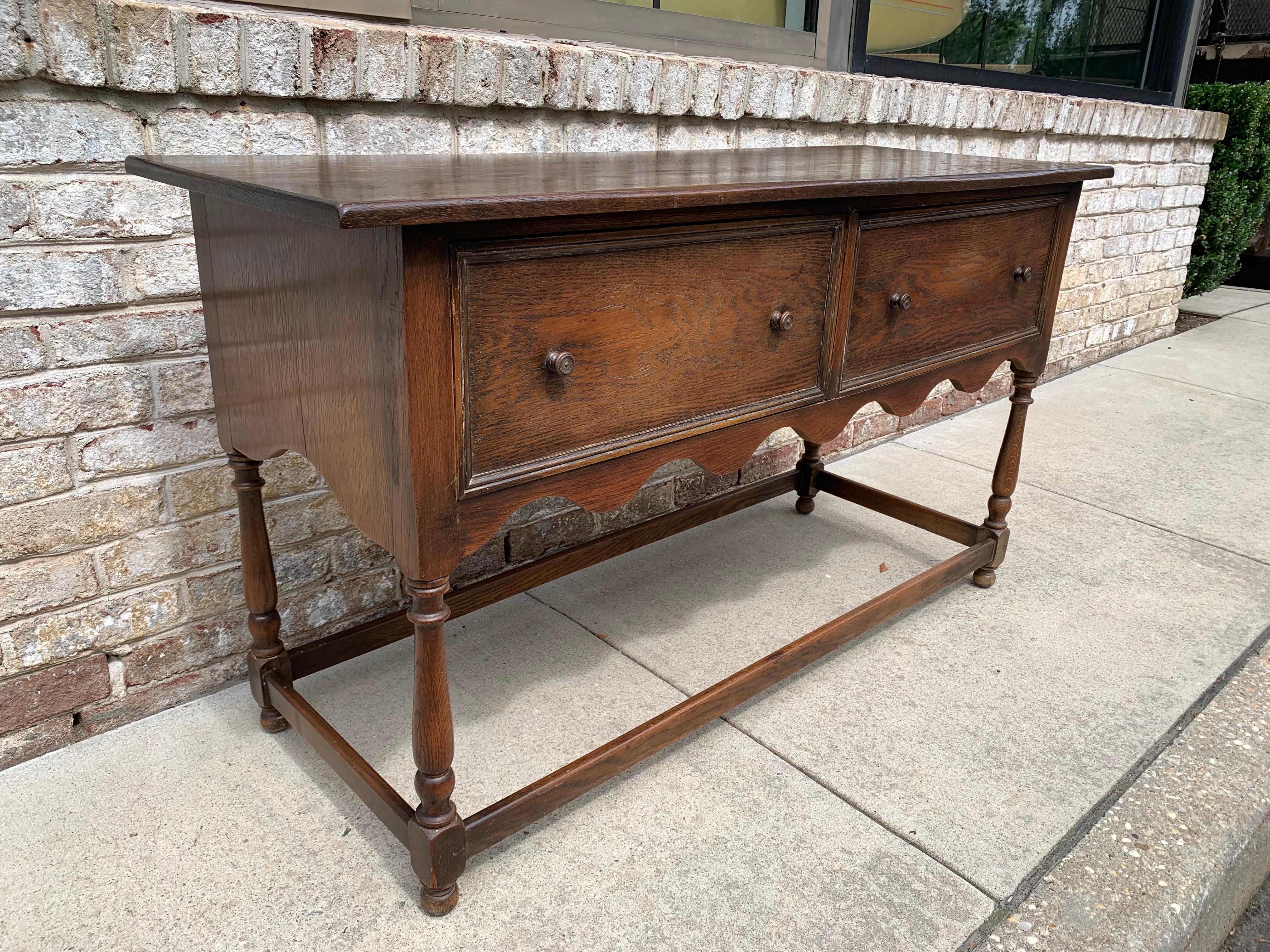With two large drawers for storage and many wonderful details such as butterfly inlay to top, spindle legs and stretchers. This beauty is a very early Kittinger creation.