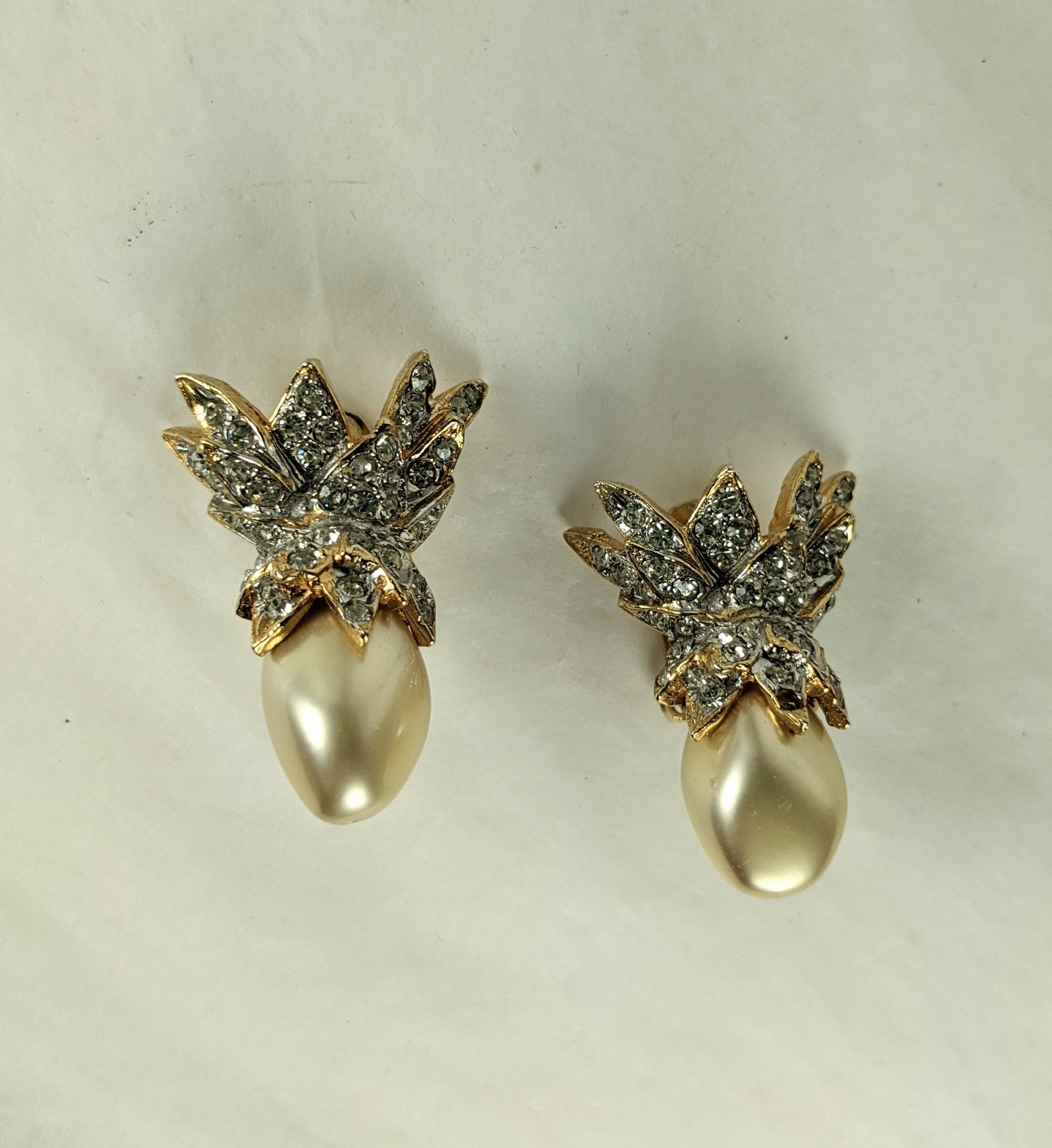 Early Kenneth Jay Lane Pave Faux Pearl Schlumberger Style Ear Clips of a faux faceted pearls with gilt pave caps. 1960's USA. 
1.5