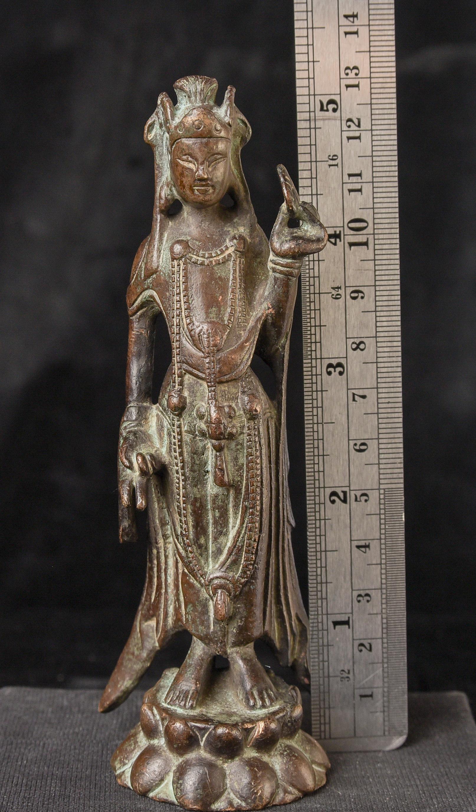 A remarkable early Korean bronze Buddha, though this iconic style was occasionally emulated in later centuries. Careful examination of the wear, patina, underside, and casting technique strongly supports an early dating, attesting to its