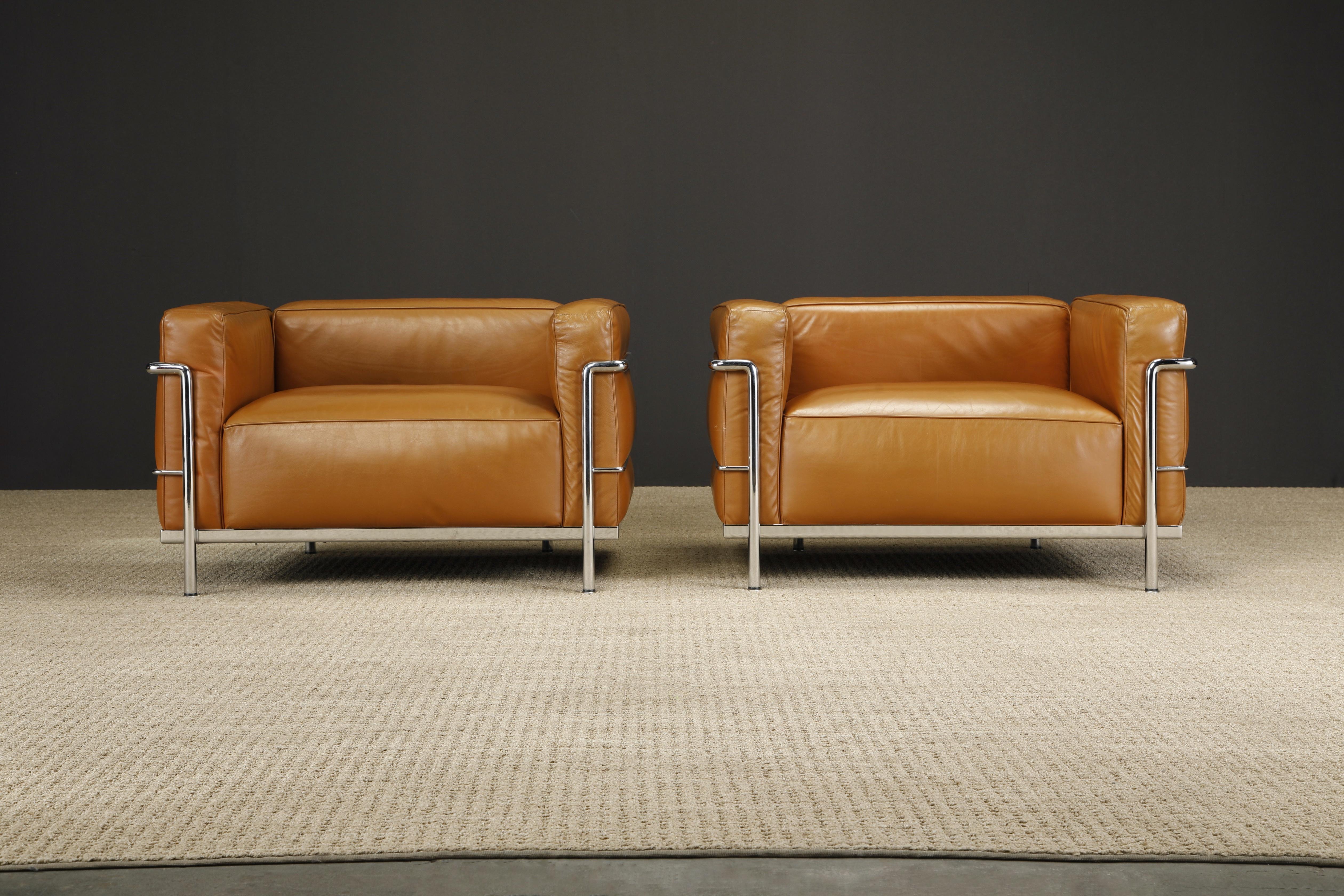 An incredible earlier year set of LC3 club chairs in original cognac brown leather and chrome frames, by Le Corbusier, Pierre Jeanneret and Charlotte Perriand for Cassina, circa 1980s, signed with AI distributor labels, and stamped to the frames