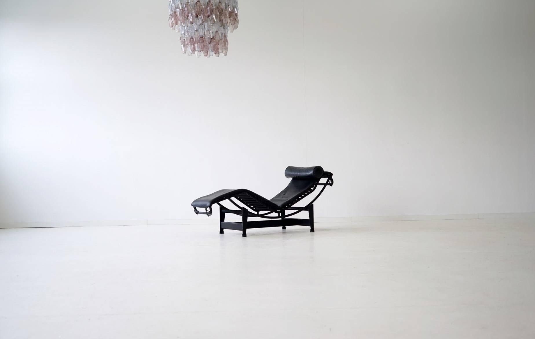 Early LC4 Le Corbusier chaise longue Cassina
Le Corbusier LC4 chaise longue for Cassina with adjustable black frame and innovative self-supporting mattress, covered in original black leather. Manufacturer number embossing. 

  
